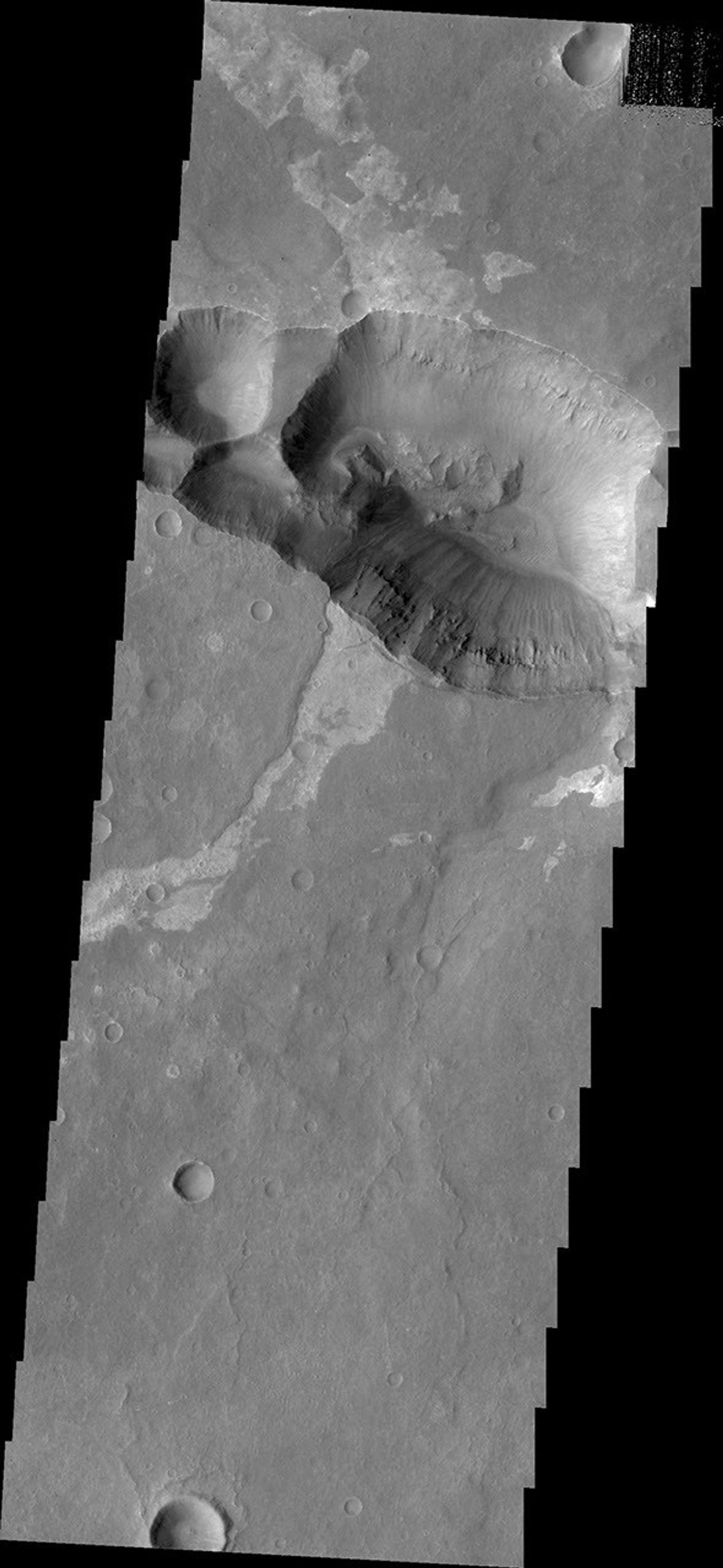 This image from NASA's 2001 Mars Odyssey spacecraft shows the shallower extension of Coprates Chamsa called Coprates Catena.