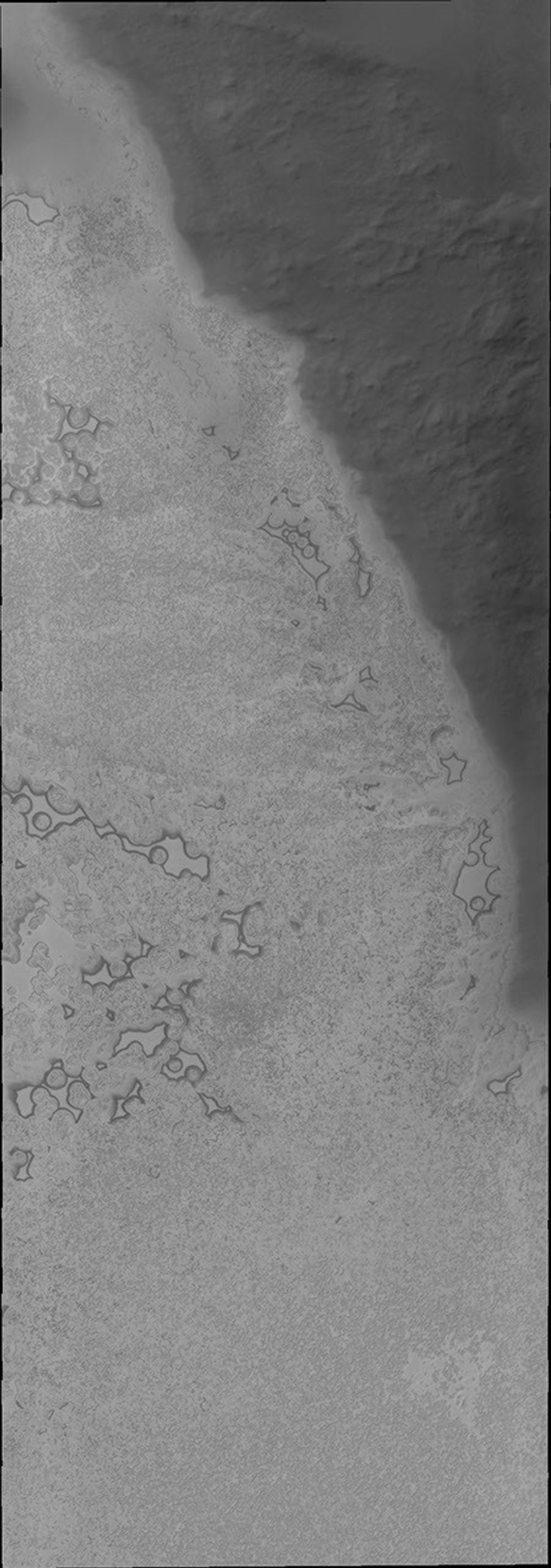 With southern summer drawing to a close, the surface of the polar ice cap will begin to frost over on Mars as seen by NASA's 2001 Mars Odyssey spacecraft.