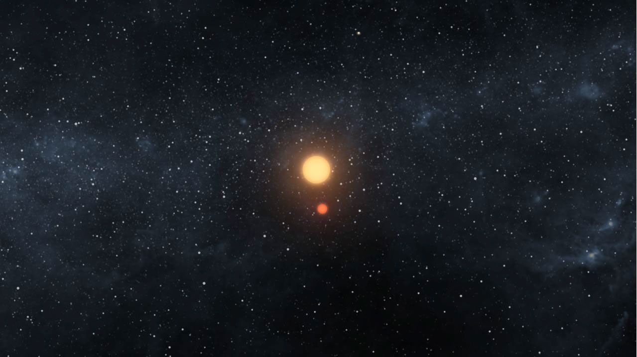This artist's image illustrates the Kepler-16 system from an overhead view, showing the eccentric orbits of the two stars as they twirl around each other every 41 days like figure skaters.