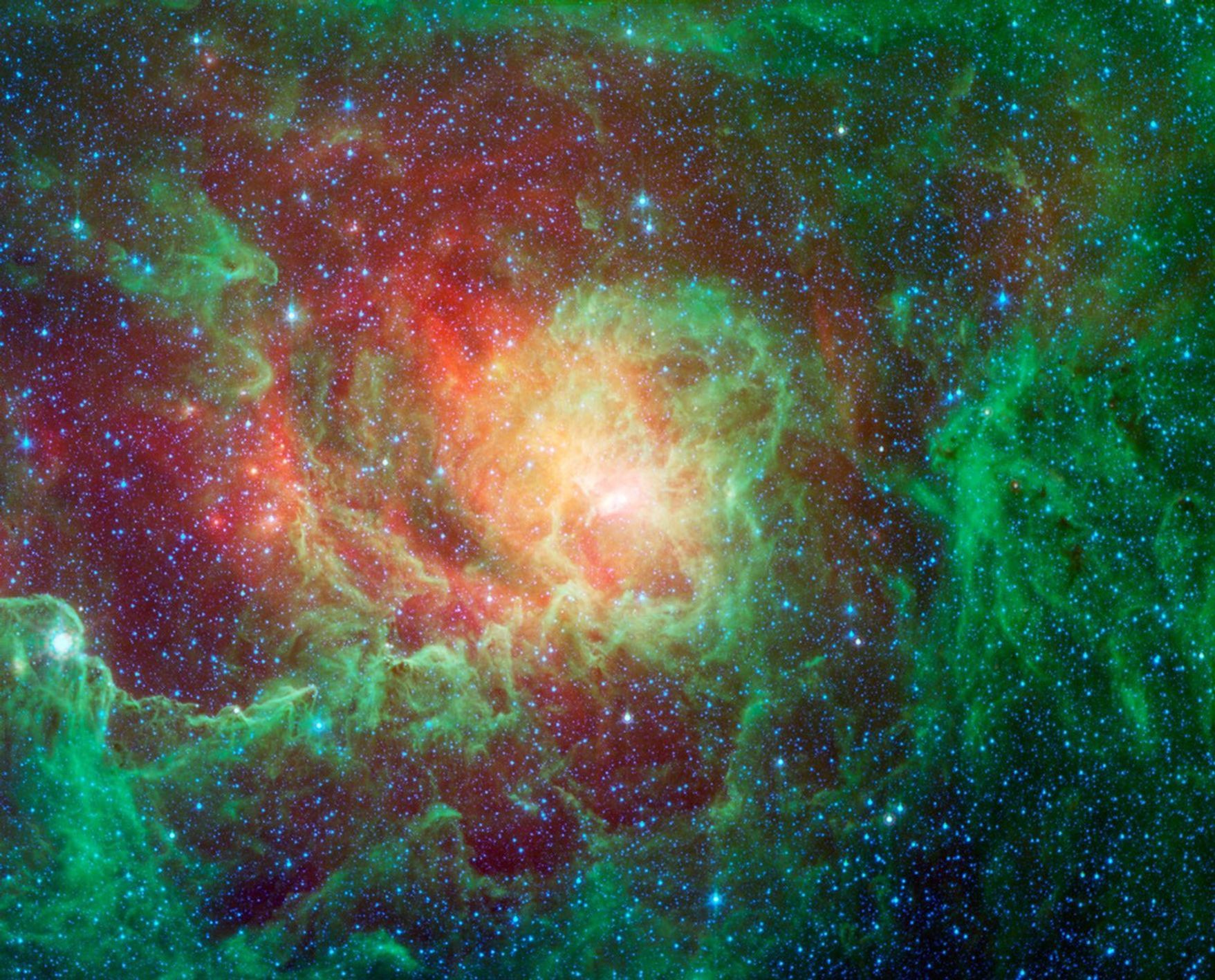 Swirling dust clouds and bright newborn stars dominate the view in this image of the Lagoon nebula from NASA's Spitzer Space Telescope. The nebula lies in the general direction of the center of our galaxy in the constellation Sagittarius.