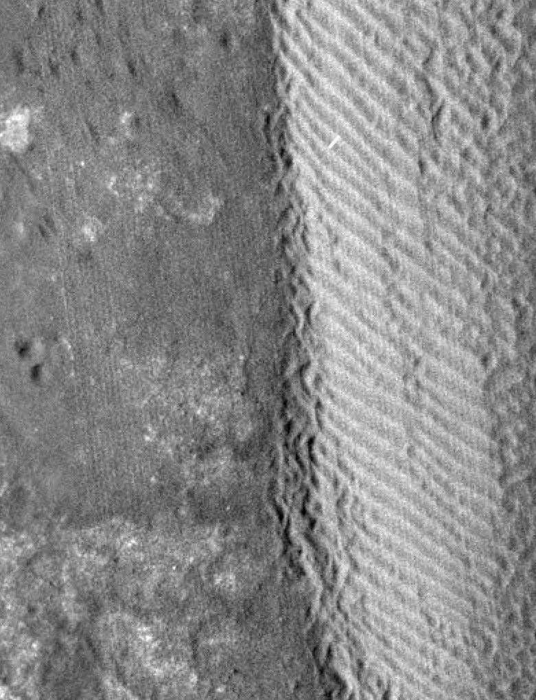 The eastern margin of a rippled dune in Herschel Crater on Mars moved an average distance of three meters (about three yards) between March 3, 2007 and December 1, 2010, in one of two images taken by NASA's Mars Reconnaissance Orbiter.