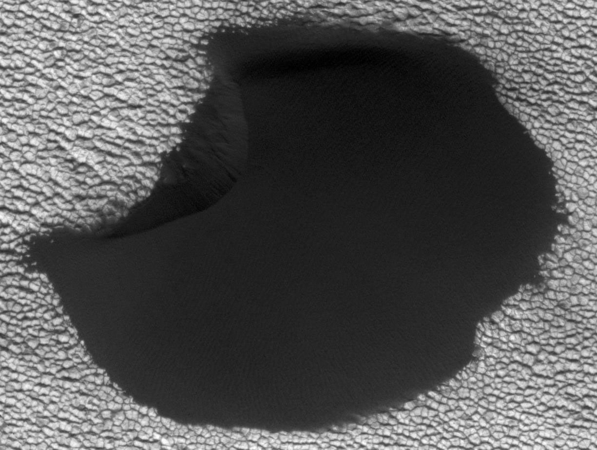 A dune in the northern polar region of Mars shows significant changes between June 25, 2008 and May 21, 2010 in one of two images taken on by NASA's Mars Reconnaissance Orbiter.
