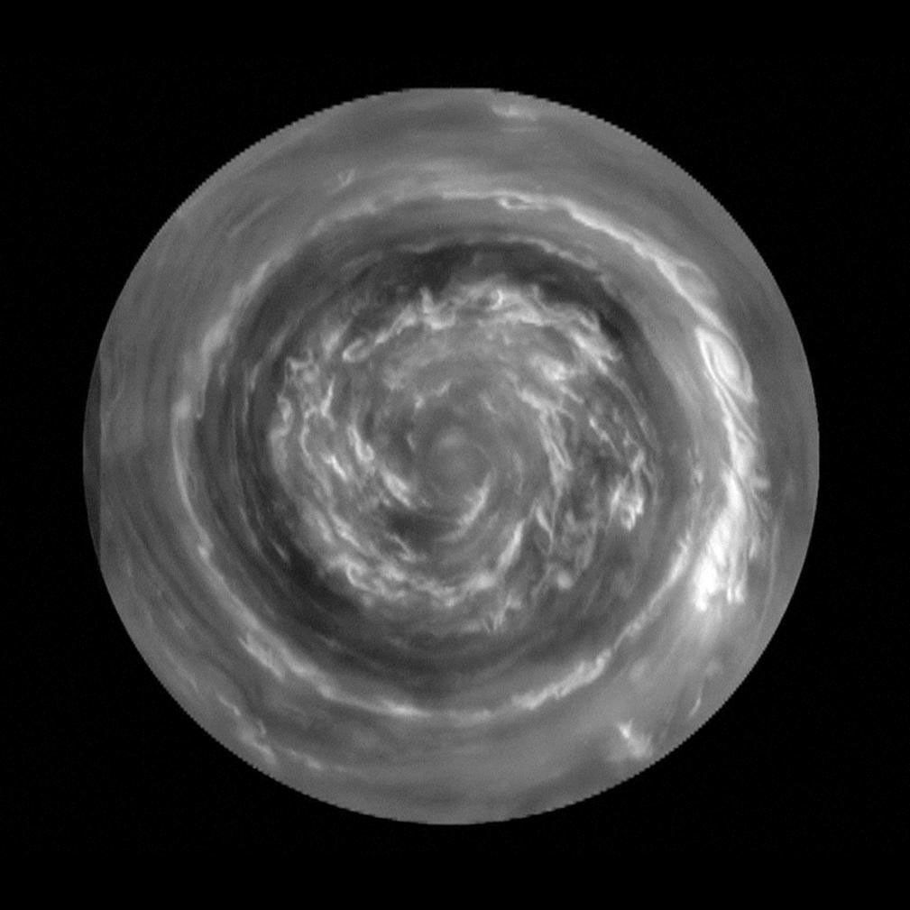 This image obtained by NASA's Cassini spacecraft, shows the clouds of a hurricane-like storm, which circulate around the north pole of Saturn out to 88.5 degrees north latitude. The clouds at the very center are spinning rapidly.