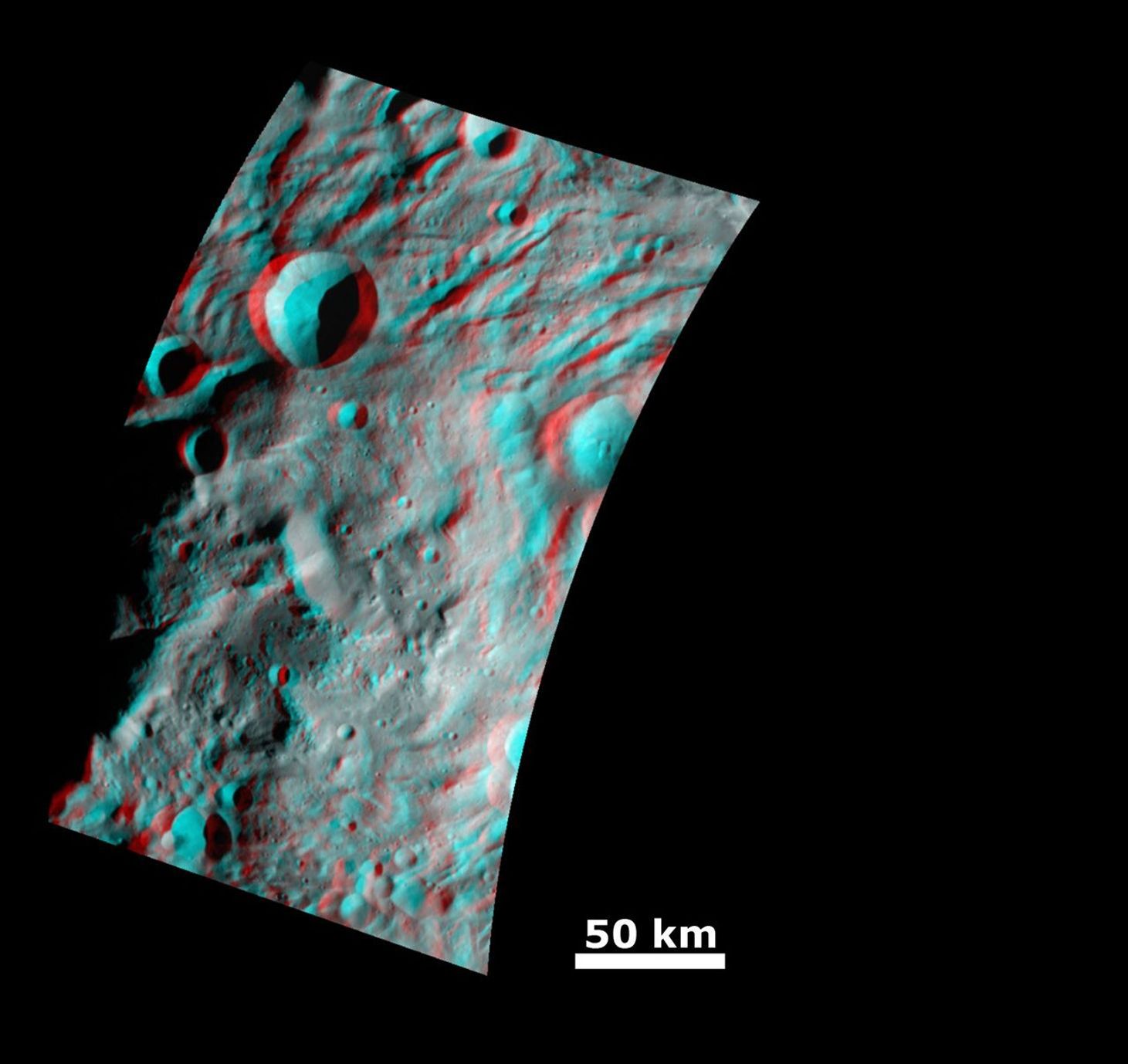 This anaglyph image from NASA's Dawn spacecraft shows the topography of the mountain-central complex in asteroid Vesta's south polar region. You need 3D glasses to view this image.