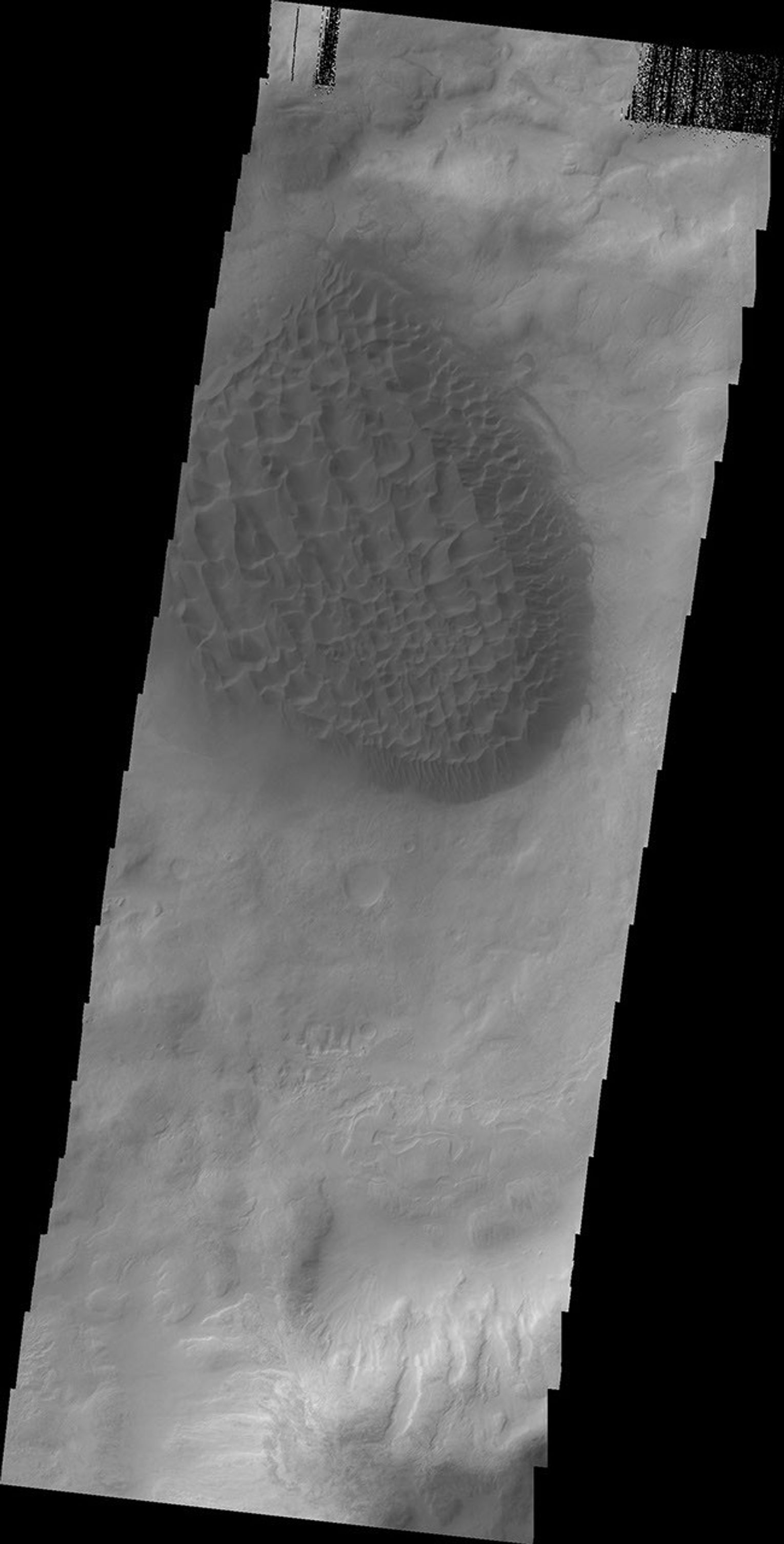 A large pile of sand with dune features on its surface is located on the floor of Matara Crater as seen by NASA's 2001 Mars Odyssey spacecraft.
