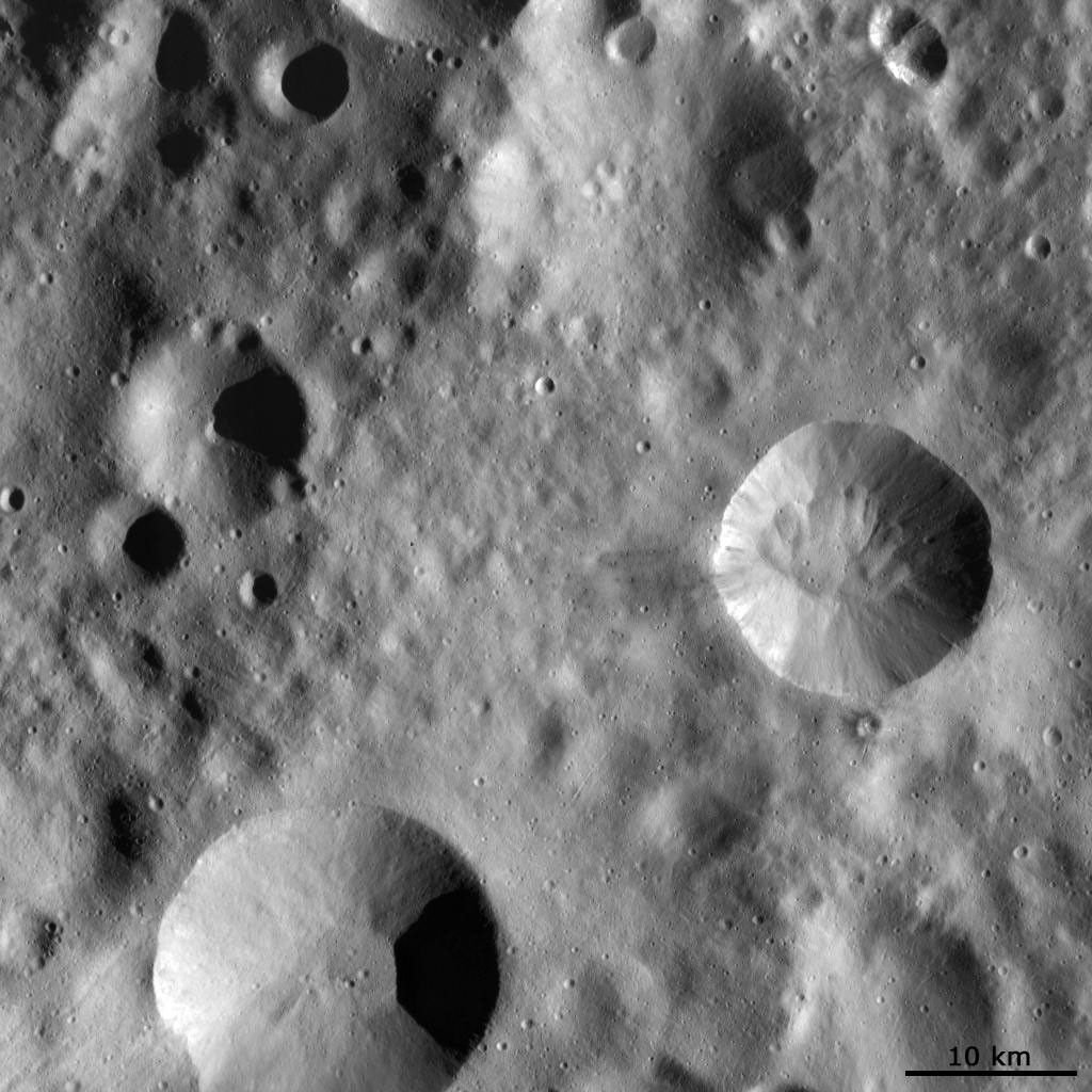 This image from NASA's Dawn spacecraft shows four large impact craters close to one another on Vesta's surface. Interestingly, each of these four has a distinct preservation state.