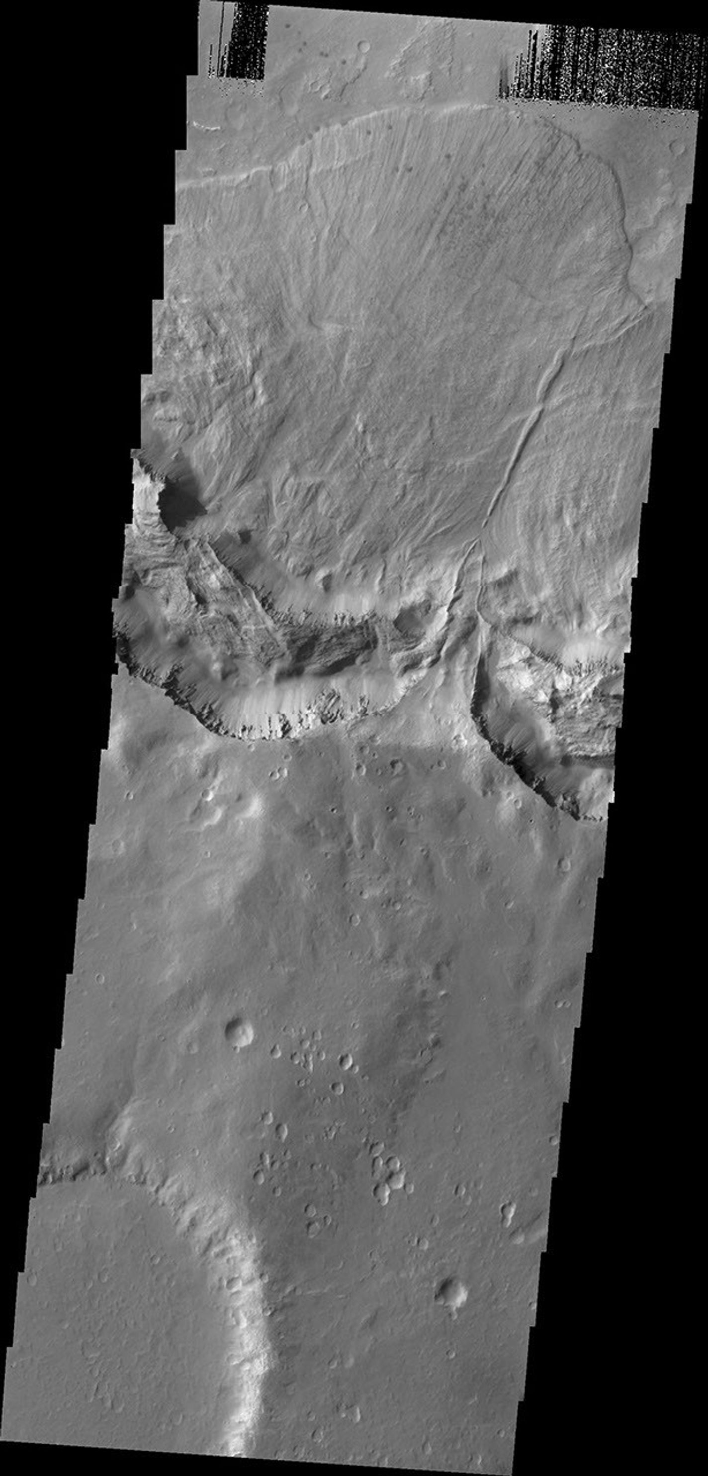 This large landslide deposit is located in an unnamed crater southwest of Holden Crater. This image was captured by NASA's 2001 Mars Odyssey spacecraft.