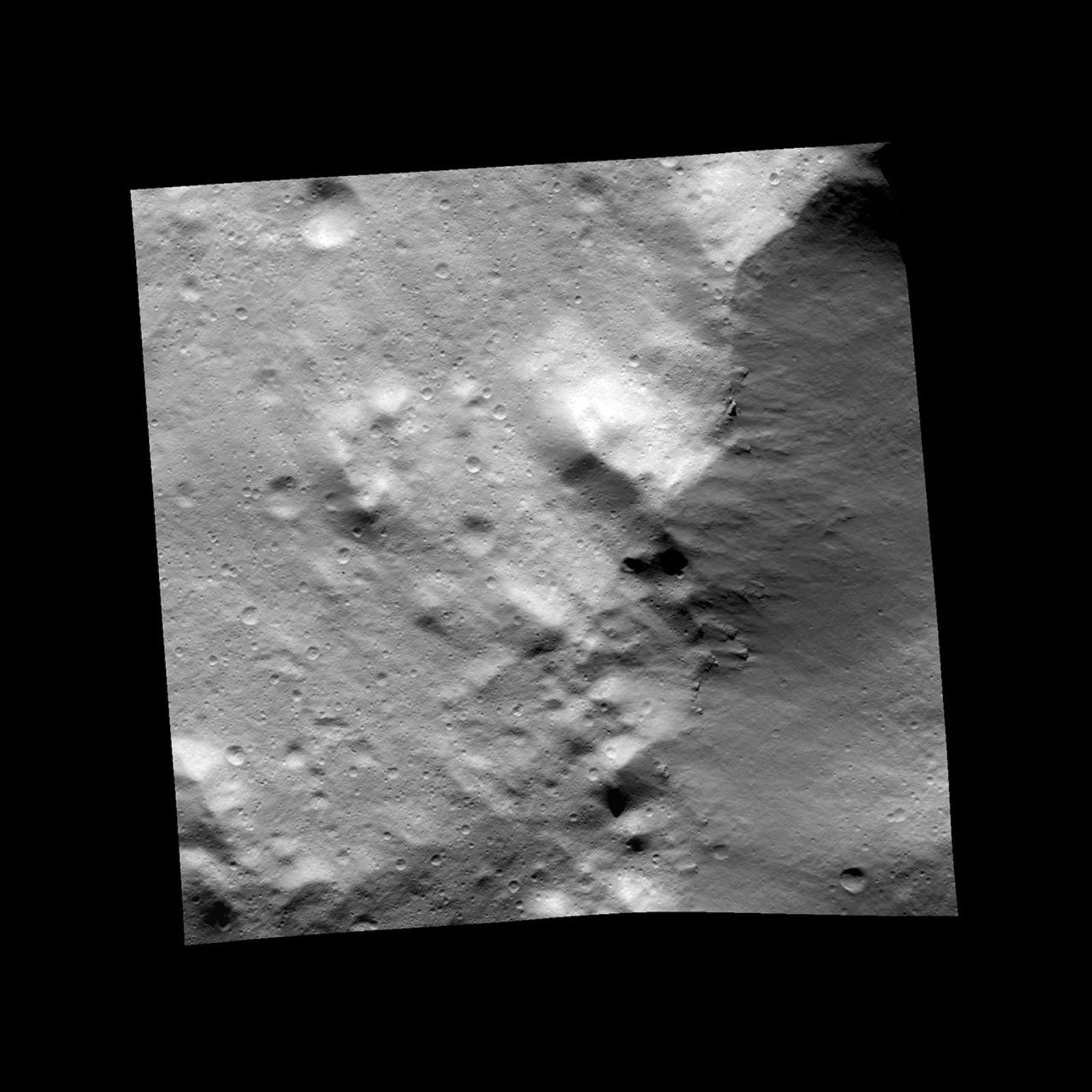 This image, one of the first obtained by NASA's Dawn spacecraft in its low altitude mapping orbit, shows an area within the Rheasilvia basin in the south polar area of the giant asteroid Vesta.