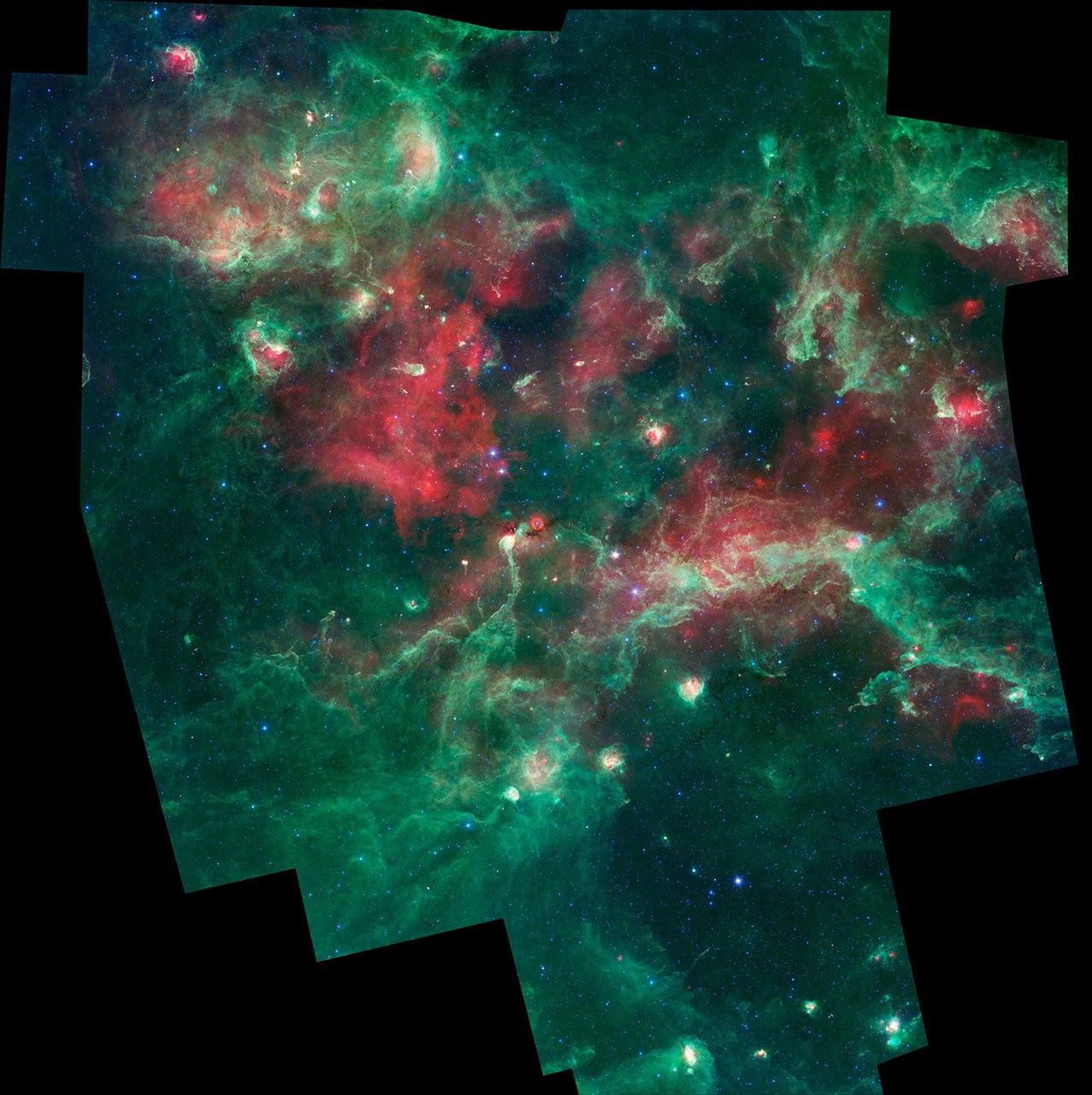 Imagen infrarroja de una región de formación de estrellas tomada por el telescopio espacial Spitzer.