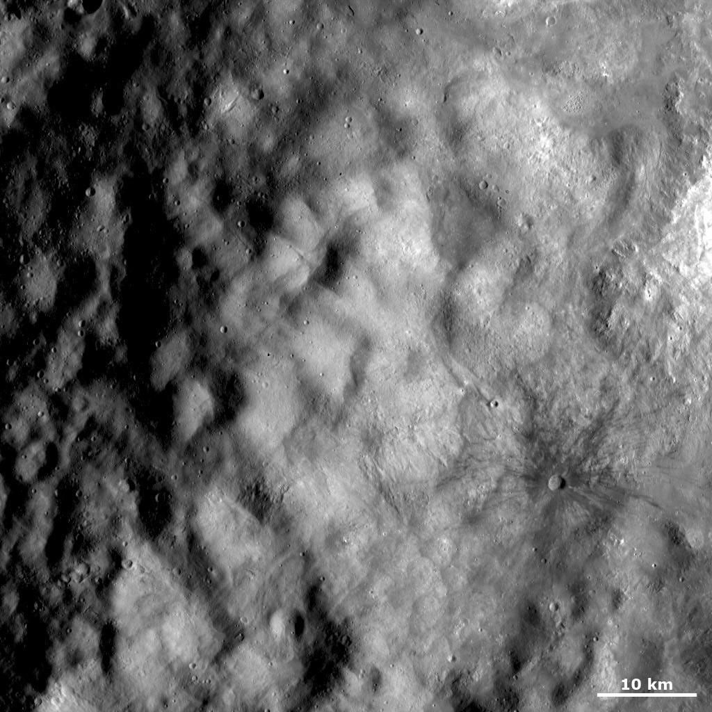 This image from NASA's Dawn spacecraft shows part of the ejecta deposit surrounding the 'snowman' craters, the largest of which has been named Marcia.