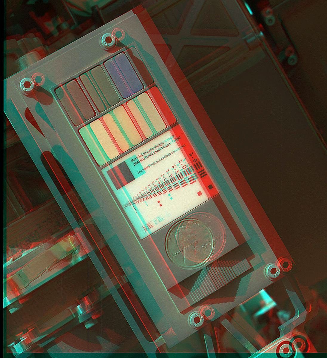 This 3-D view of the calibration target for the MAHLI camera aboard NASA's Mars rover Curiosity was assembled from two images taken by that camera during the 34th Martian day. The camera is on the turret of tools at the end of Curiosity's robotic arm.