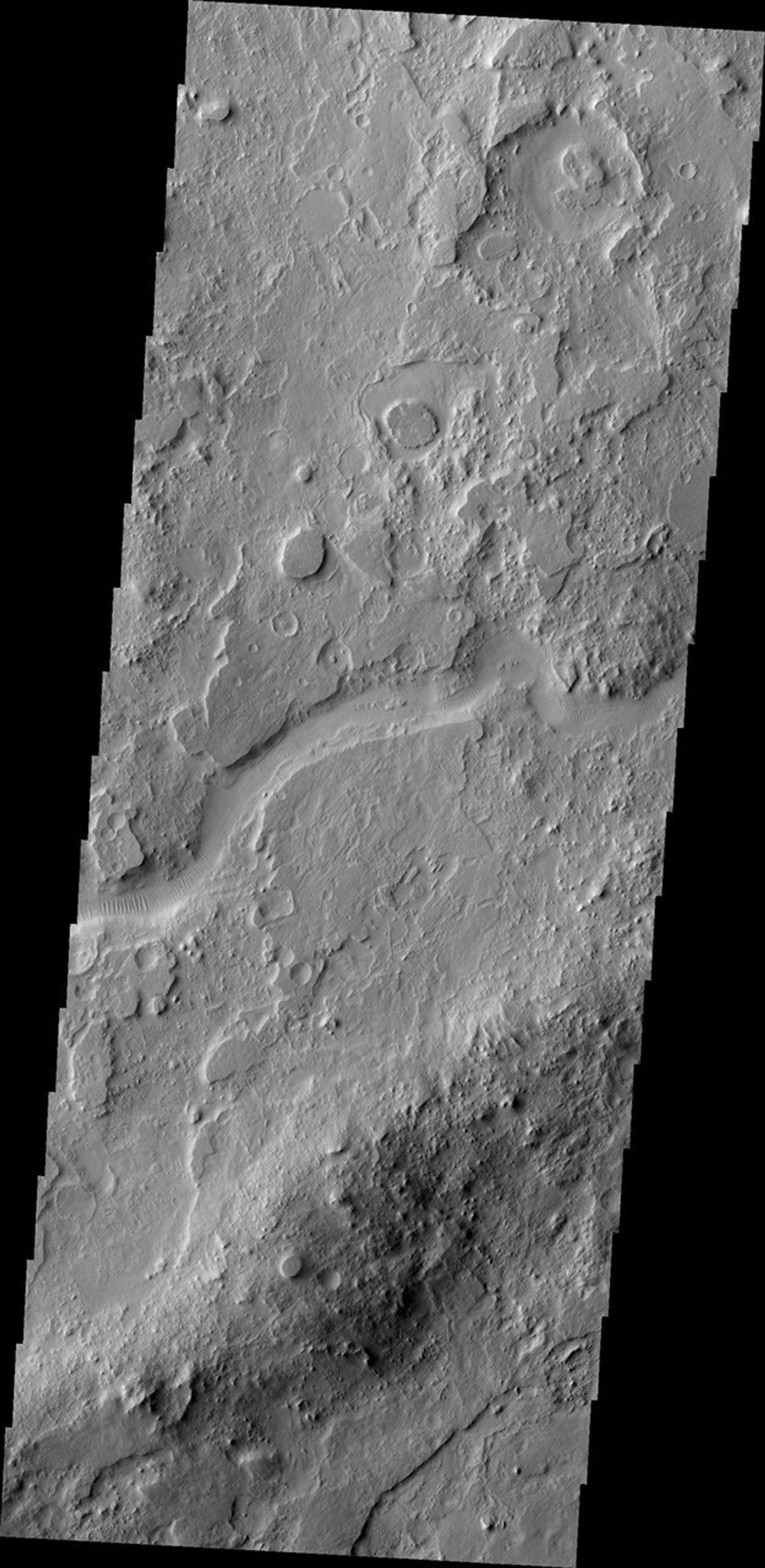 The channel in this image from NASA's Mars Odyssey spacecraft is part of Auqakuh Vallis, which is located in northern Terra Sabaea on Mars.