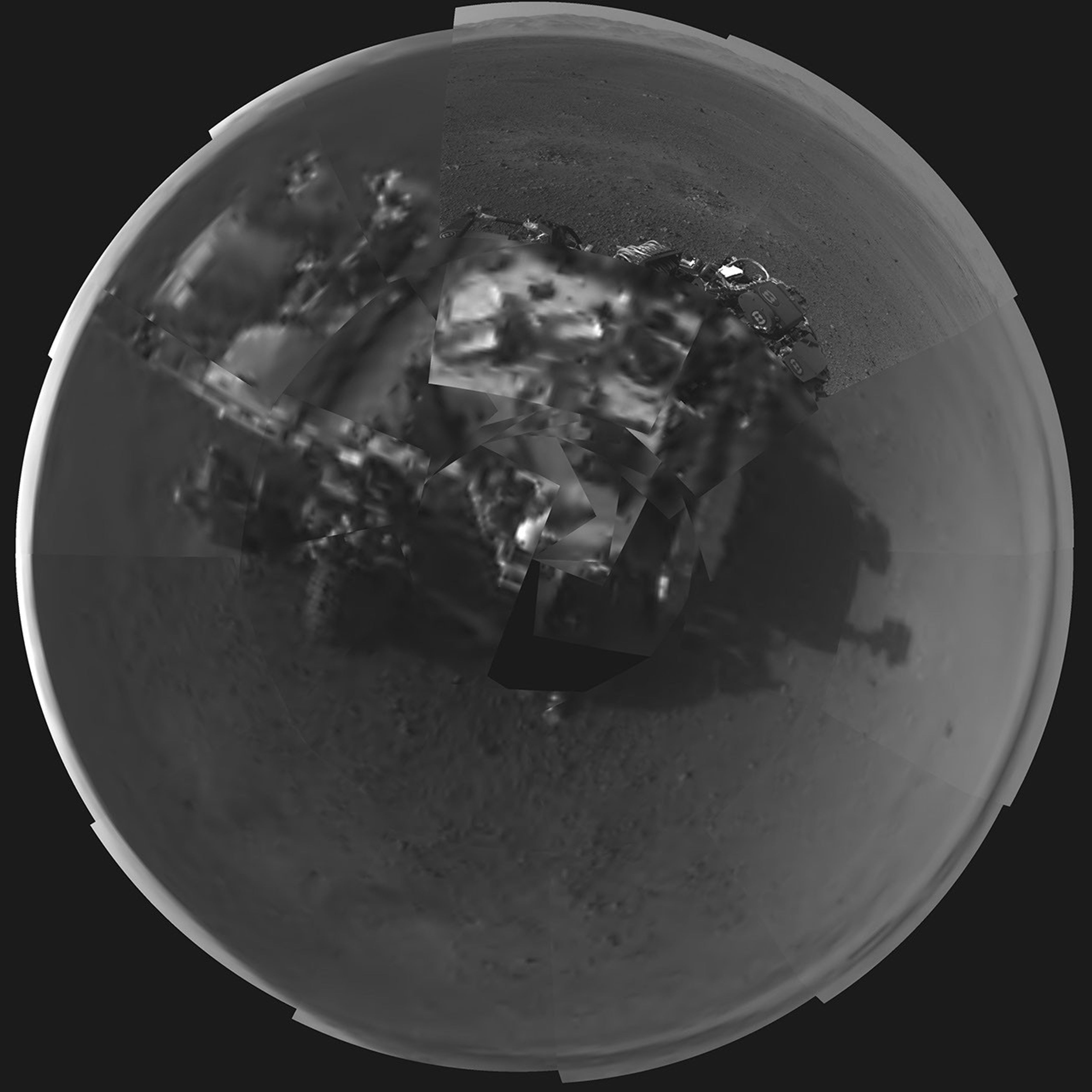 This Picasso-like self portrait of NASA's Curiosity rover was taken by its Navigation cameras, located on the now-upright mast. The camera snapped pictures 360-degrees around the rover, while pointing down at the rover deck, up and straight ahead.