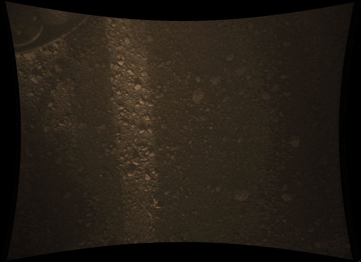 This full-resolution color image from NASA's Curiosity Rover shows the gravel-covered surface of Mars. It was taken by the Mars Descent Imager (MARDI) several minutes after Curiosity touched down on Mars.