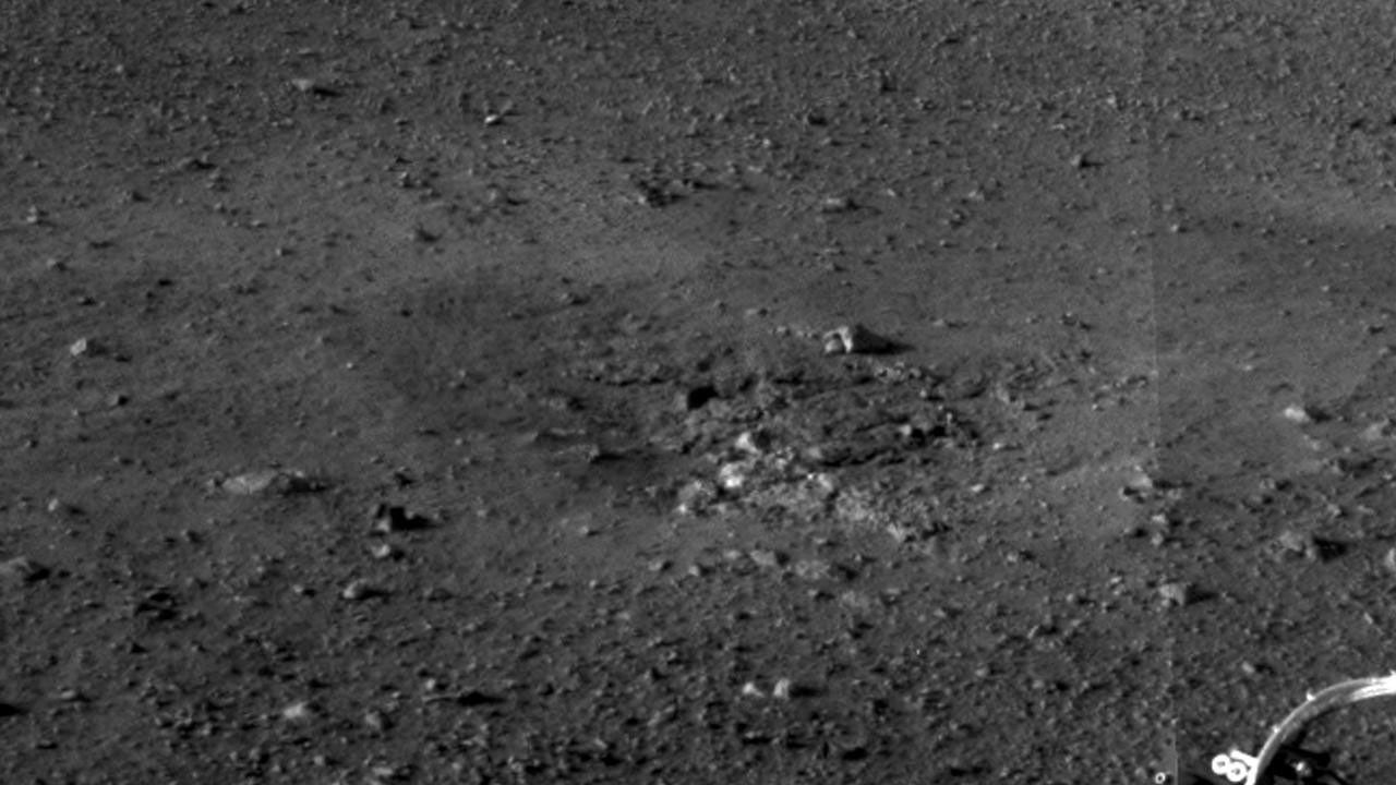 This is a close-up view of the zones where the soil at Curiosity's landing site was blown away by the thrusters on the rover's descent stage. The excavation of the soil reveals probable bedrock outcrop.