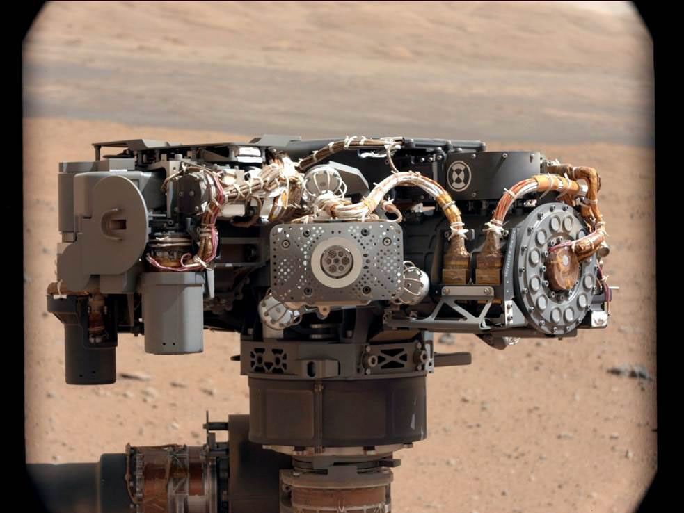 This image shows the Alpha Particle X-Ray Spectrometer (APXS) on NASA's Curiosity rover, with the Martian landscape in the background. This image let researchers know that the APXS instrument had not become caked with dust during Curiosity's landing.