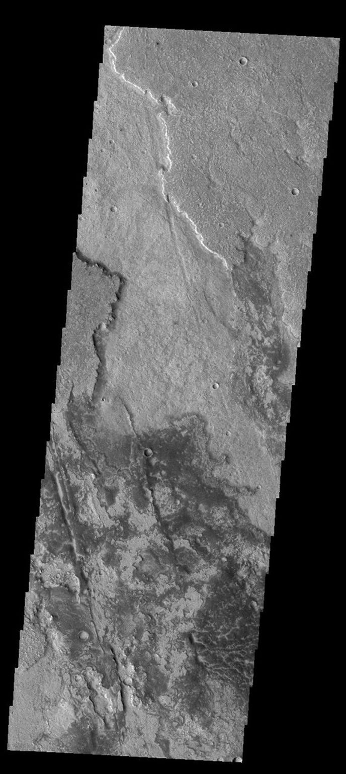 This image captured by NASA's 2001 Mars Odyssey spacecraft shows a small portion of the lava flows of Solis Planum.