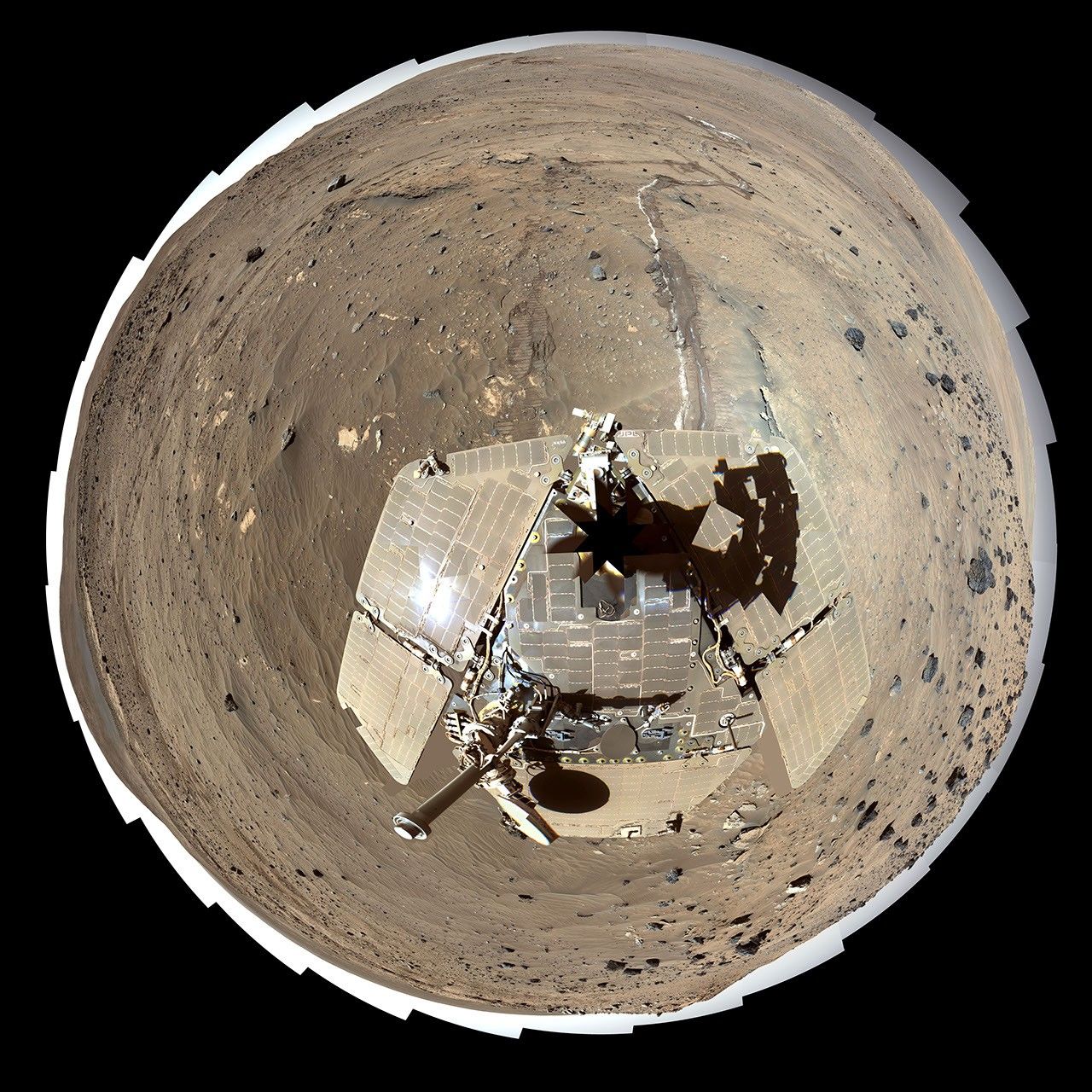 This self-portrait of NASA's Mars Exploration Rover Spirit is a false color polar projection of the 360-degree 'McMurdo' panorama made from images taken by Spirit from April through October 2006.