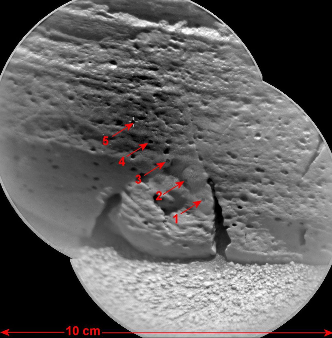 This view of a rock called 'Rocknest 3' combines two images taken by the Chemistry and Camera (ChemCam) instrument on the NASA Mars rover Curiosity and indicates five spots where ChemCam had hit the rock with laser pulses to check its composition.