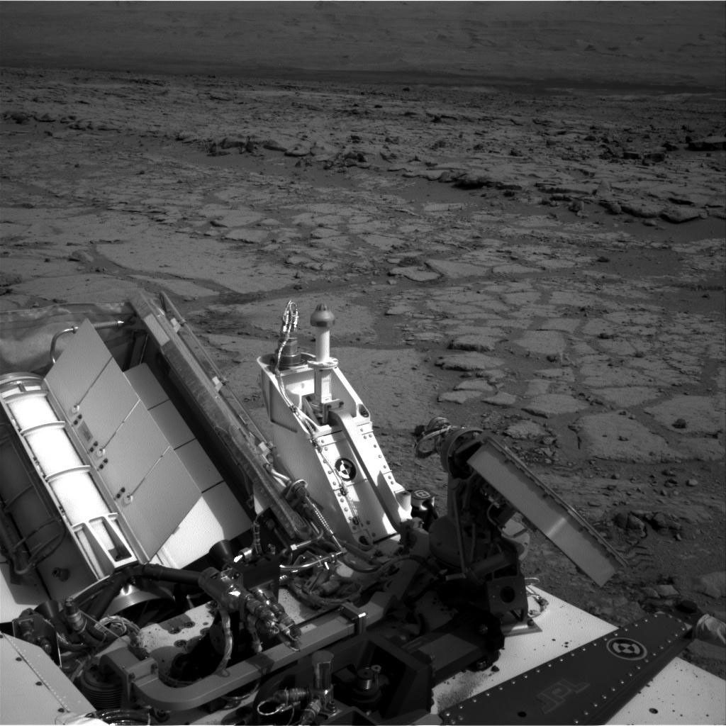 The NASA Mars rover Curiosity used its left Navigation Camera to record this view of the step down into a shallow depression called 'Yellowknife Bay.' The descent into the basin crossed a step about 2 feet high, visible in the upper half of this image.