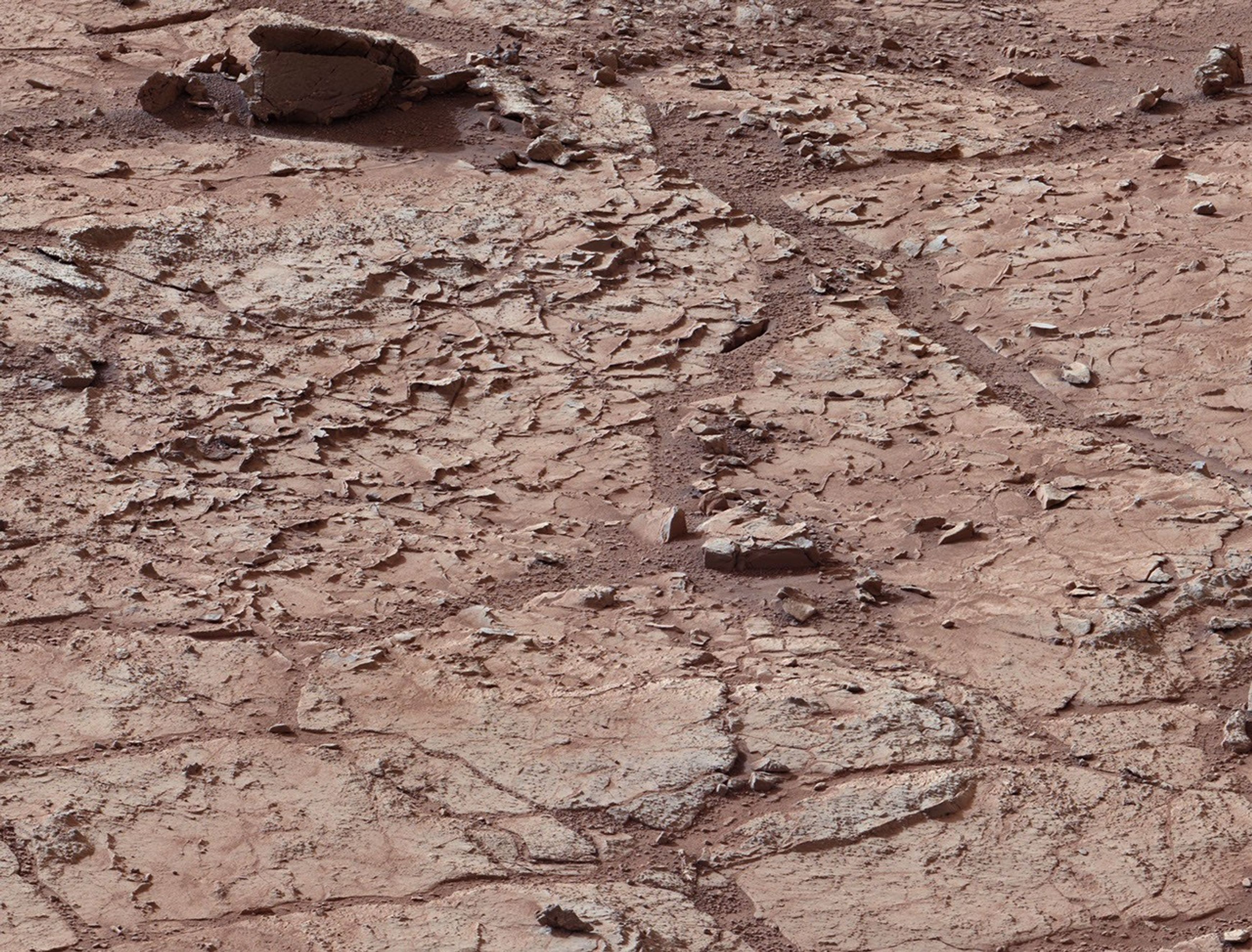 This view shows the patch of veined, flat-lying rock selected as the first drilling site for NASA's Mars rover Curiosity.