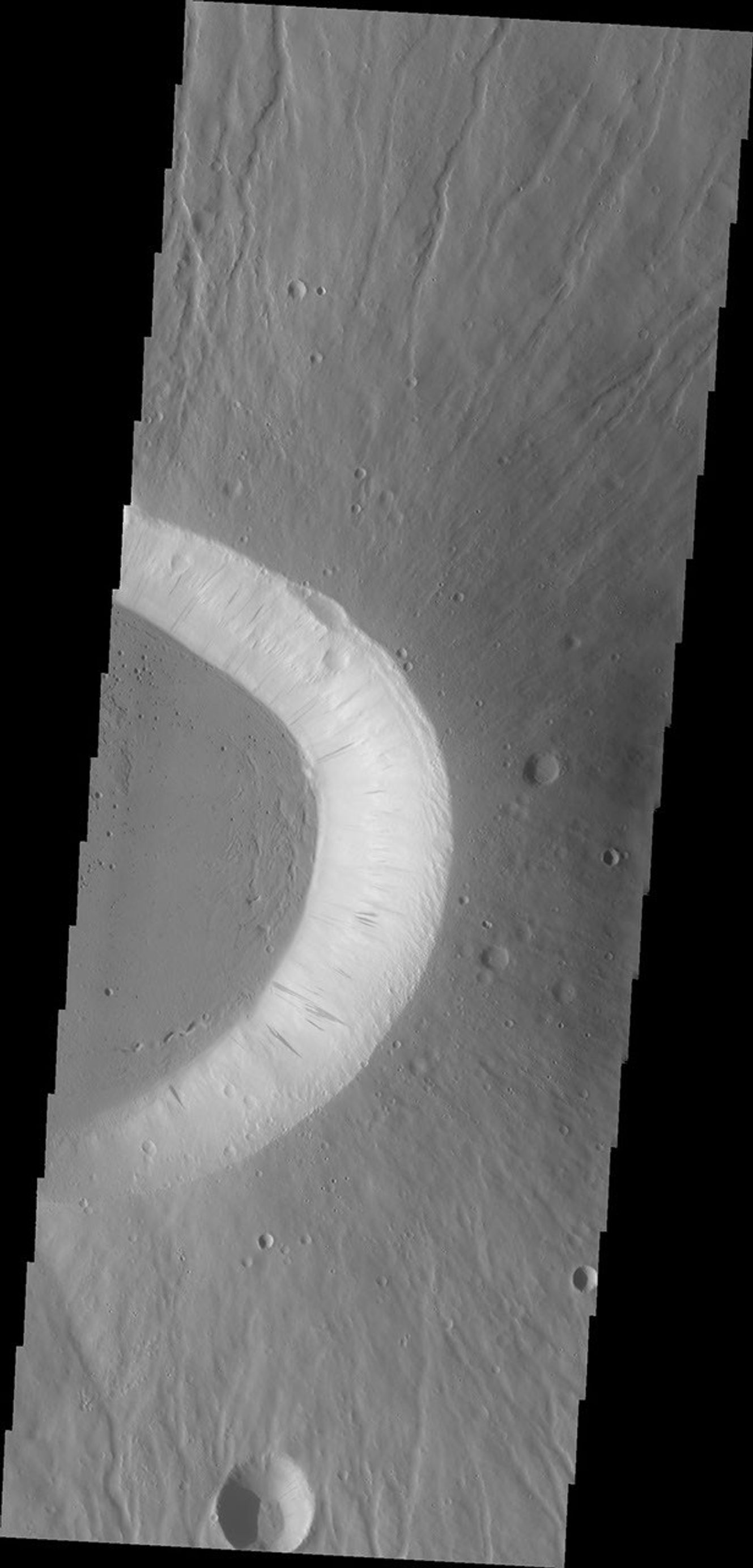 Today's image shows the eastern side of the summit caldera of Ceraunius Tholus as seen by NASA's 2001 Mars Odyssey spacecraft.