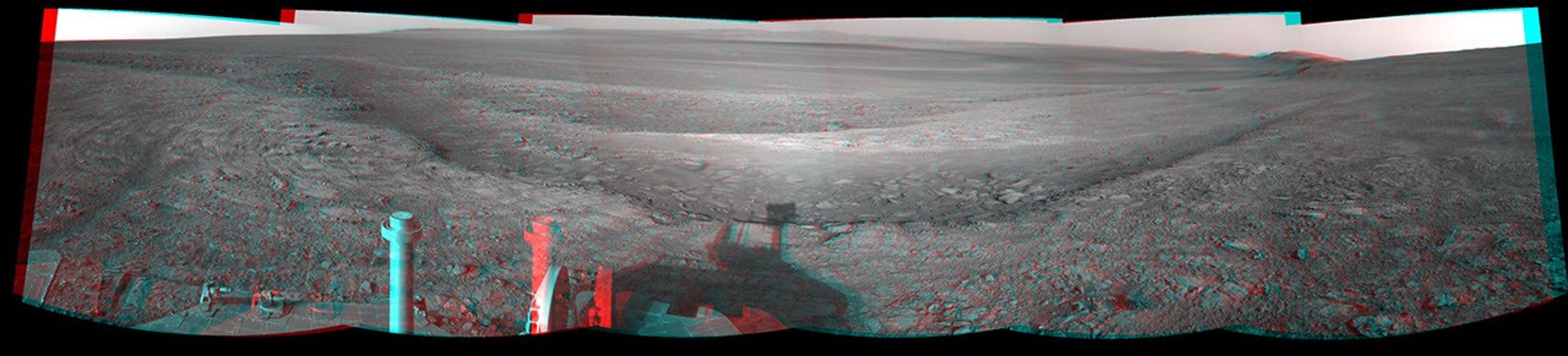 This 3-D view from the navigation camera on NASA's Mars Exploration Rover Opportunity shows a vista across Endeavour Crater, with the rover's own shadow in the foreground.
