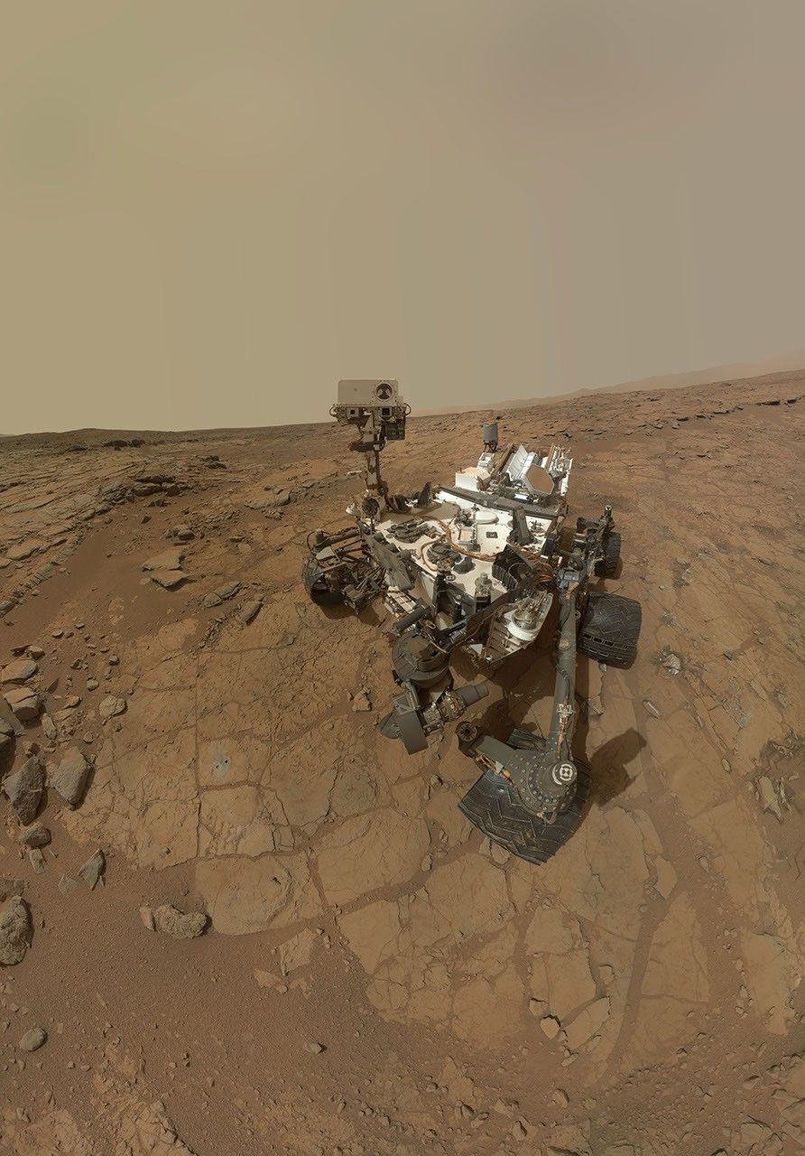 This self-portrait of NASA's Mars rover Curiosity combines dozens of exposures to show gray-powder and two holes where Curiosity used its drill on the rock target 'John Klein.'