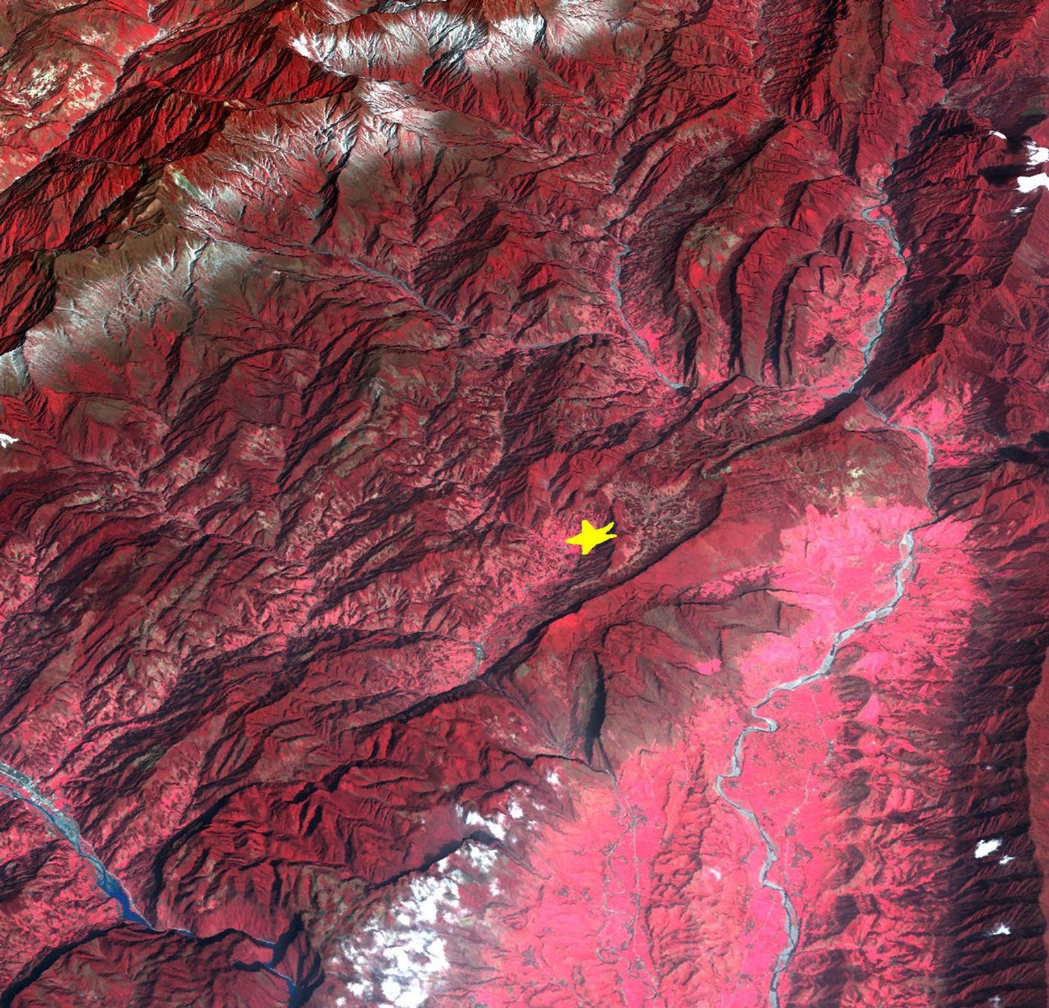 This image from NASA's Terra spacecraft highlights the epicenter of a powerful magnitude 6.6 earthquake which struck Sichuan Province in southwest China on April 20, 2013. Vegetation is displayed in red; clouds and snow are in white.