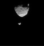 This frame from a movie clip shows the larger of Mars' two moons, Phobos, passing in front of the smaller Martian moon, Deimos, as observed by NASA's Mars rover Curiosity.