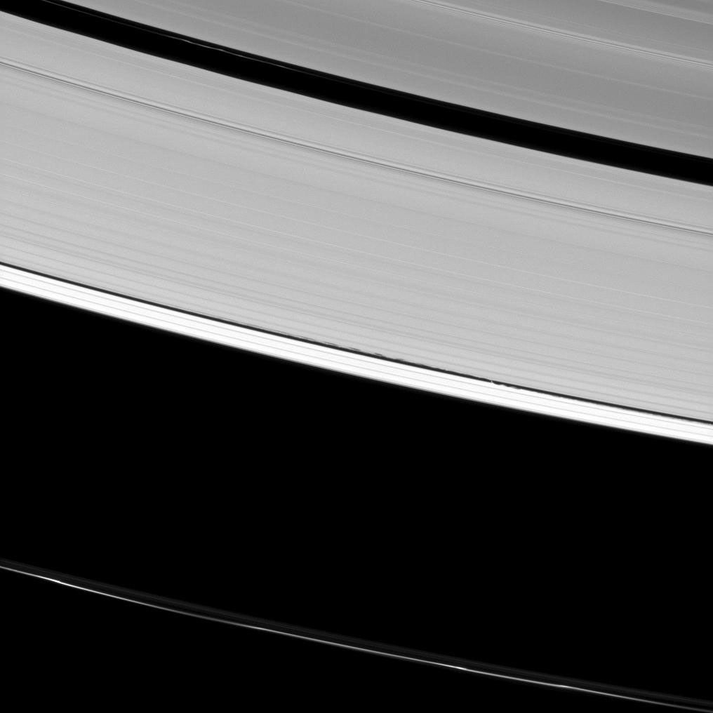 Saturn's A ring is decorated with several kinds of waves. NASA's Cassini spacecraft has captured a host of density waves, a bending wave, and the edge waves on the edge of the Keeler gap caused by the small moon Daphnis.