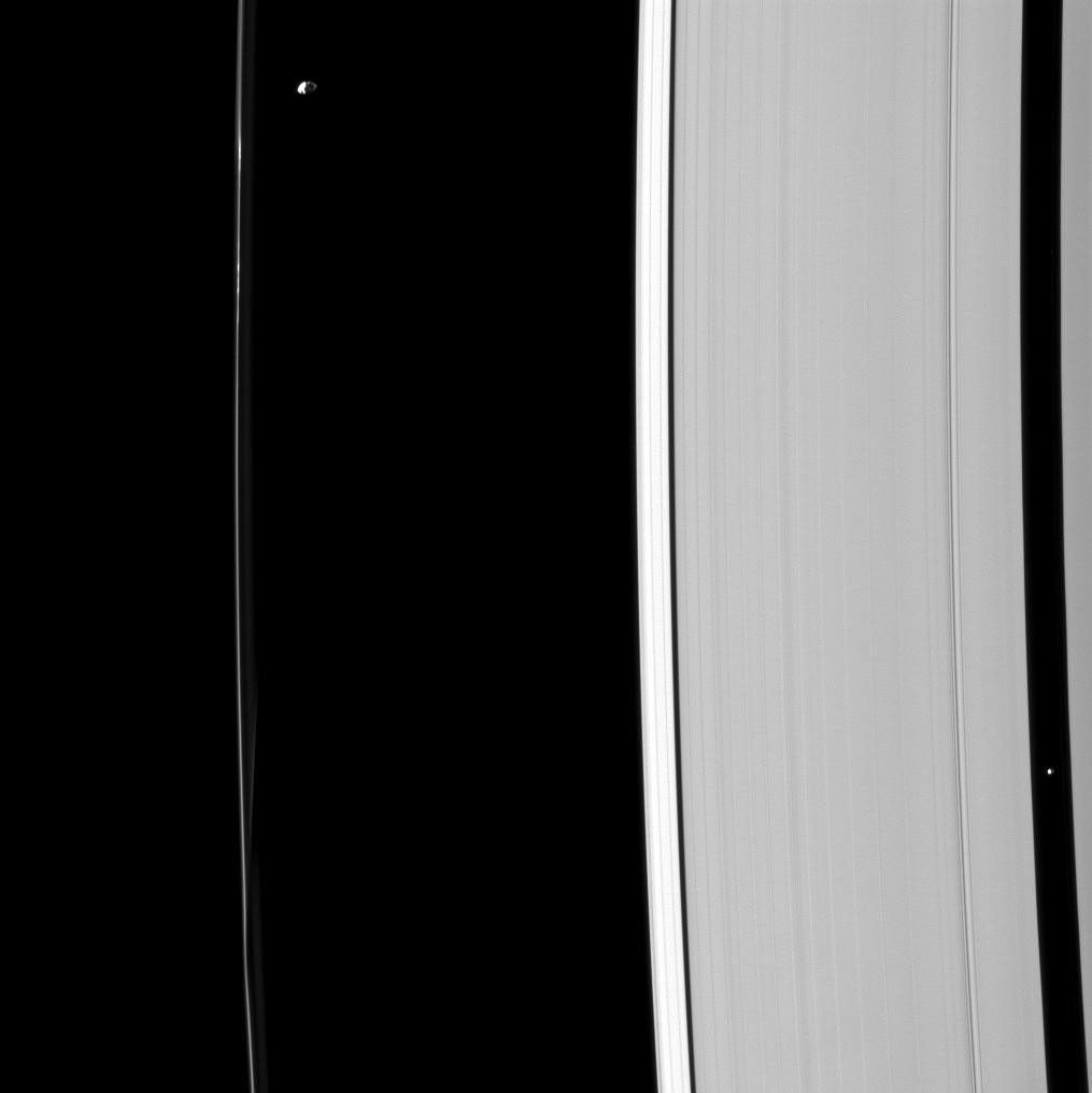 Although their gravitational effects on nearby ring material look quite different, Prometheus and Pan are both shepherd moons, holding back nearby ring edges in this image captured by NASA's Cassini spacecraft.