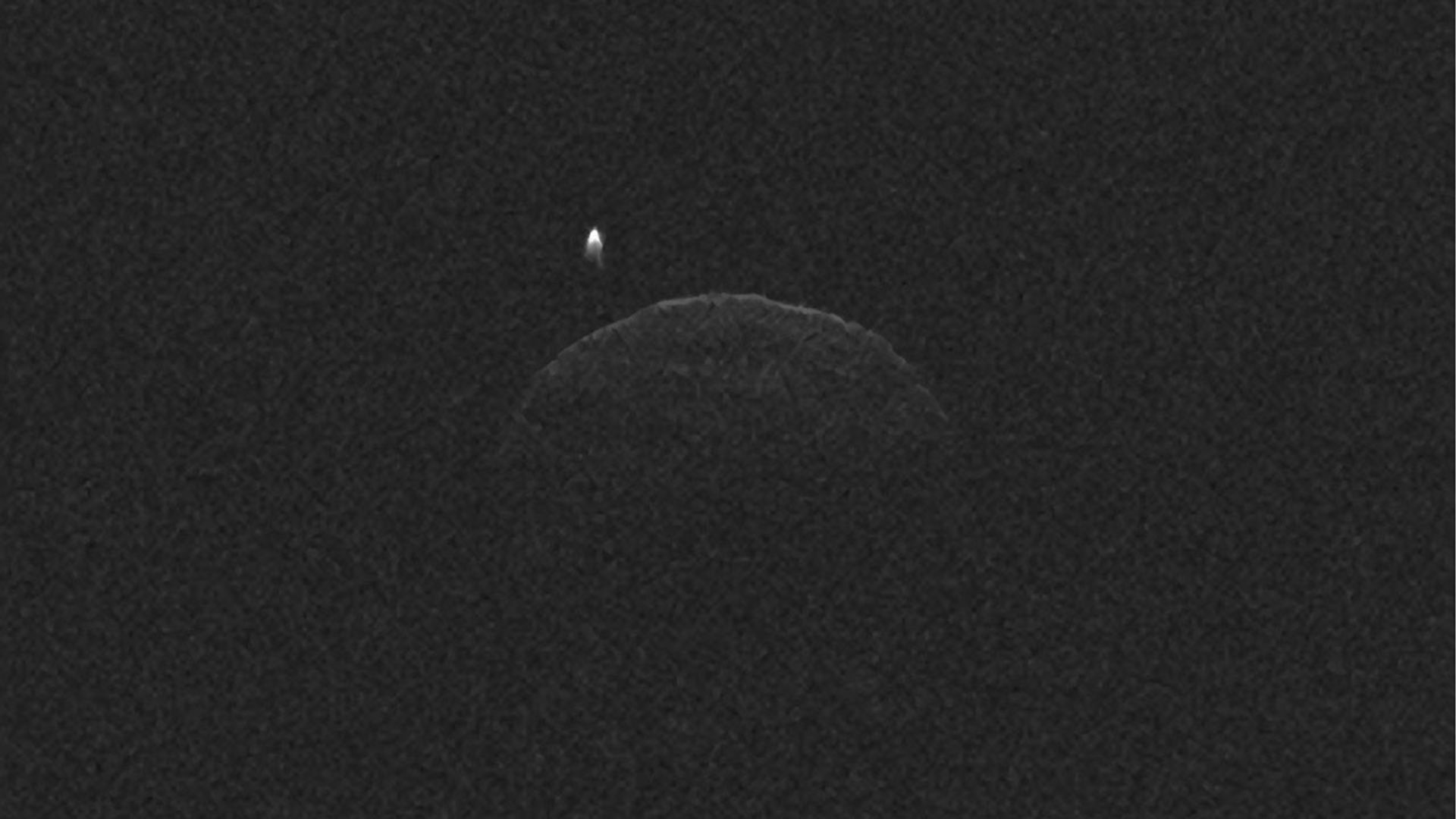 This radar imagery of asteroid 1998 QE2 and its moon was generated from data collected by NASA's 230-foot-wide (70-meter) Deep Space Network antenna at Goldstone, Calif., on June 1, 2013.