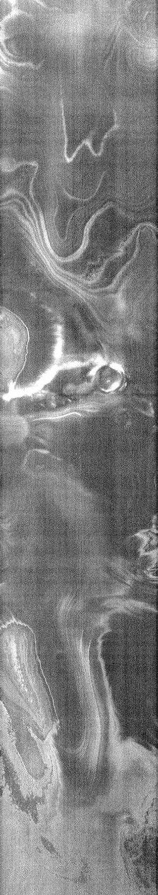 This image from NASA's Mars Odyssey spacecraft shows martiain terrain that resembles glaring eyes and the nose of a giant man.