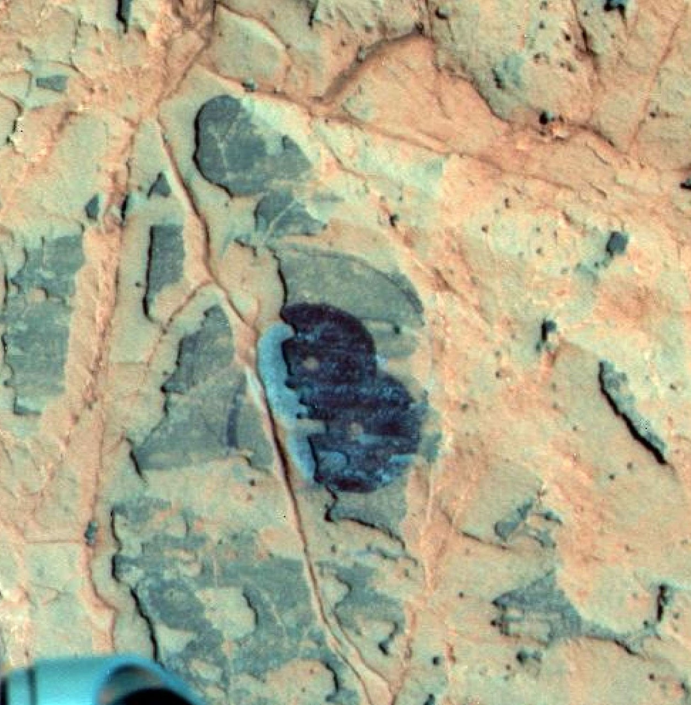Researchers used NASA's Mars Exploration Rover Opportunity to find a water-related mineral on the ground that had been detected from orbit, and found it in the dark veneer of rocks on the rim of Endeavour Crater.