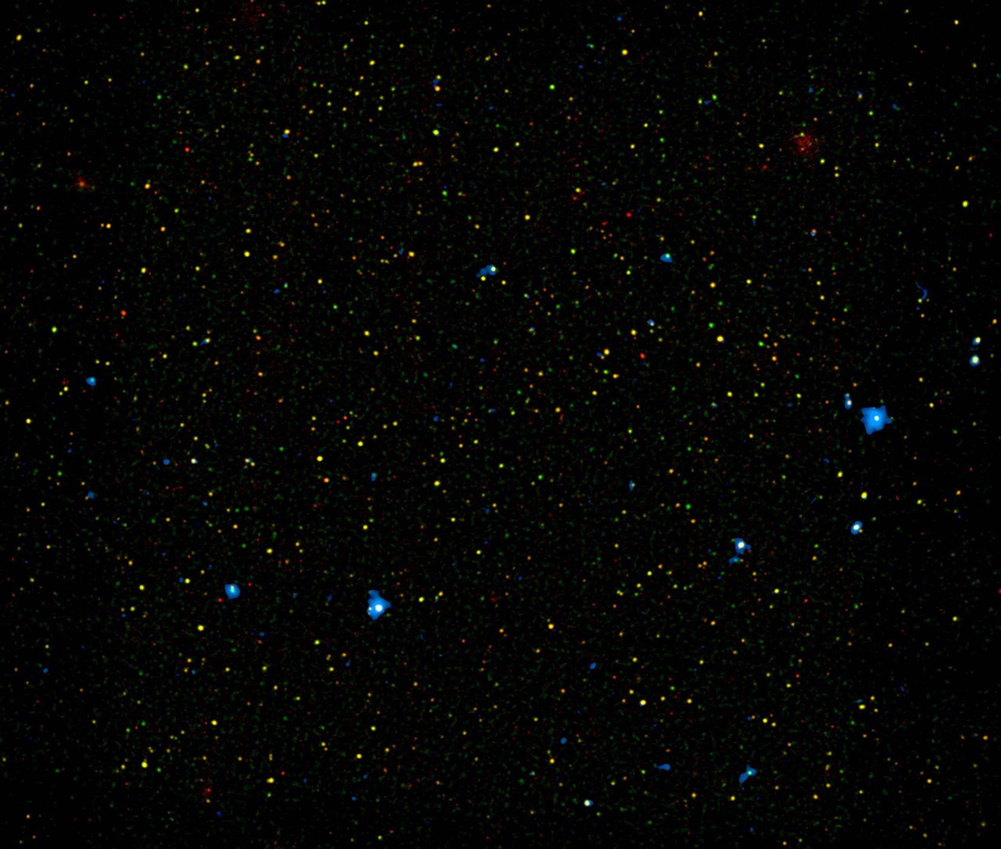 A range of supermassive black holes lights up this new image from NASA's NuSTAR. All of the dots are active black holes tucked inside the hearts of galaxies, with colors representing different energies of X-ray light.