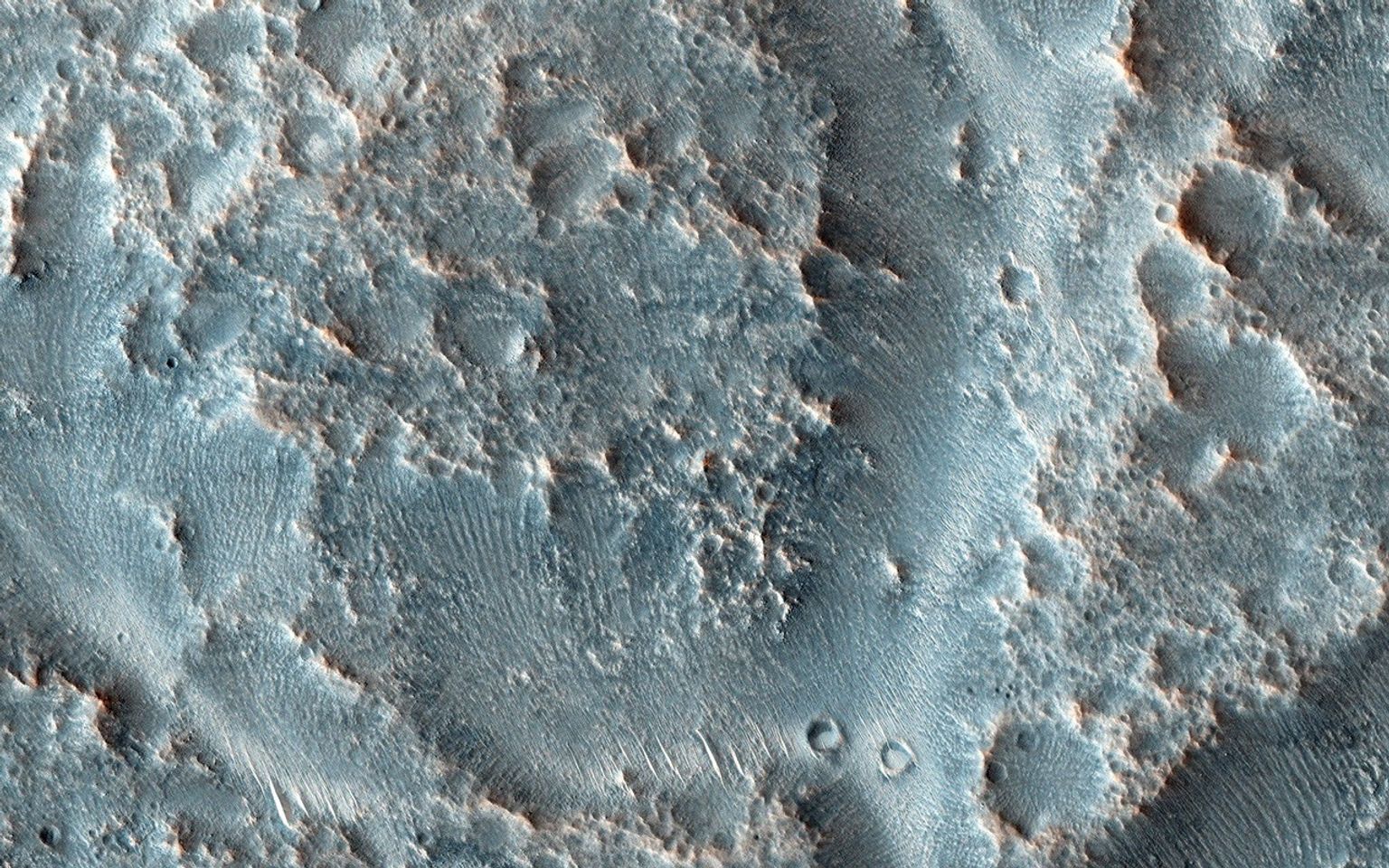 As rivers age they can meander and occasionally these meanders get so pronounced that the river cuts off these curving loops at their narrow end leaving them as isolated as oxbow lakes. Image from NASA's Mars Reconnaissance Orbiter.