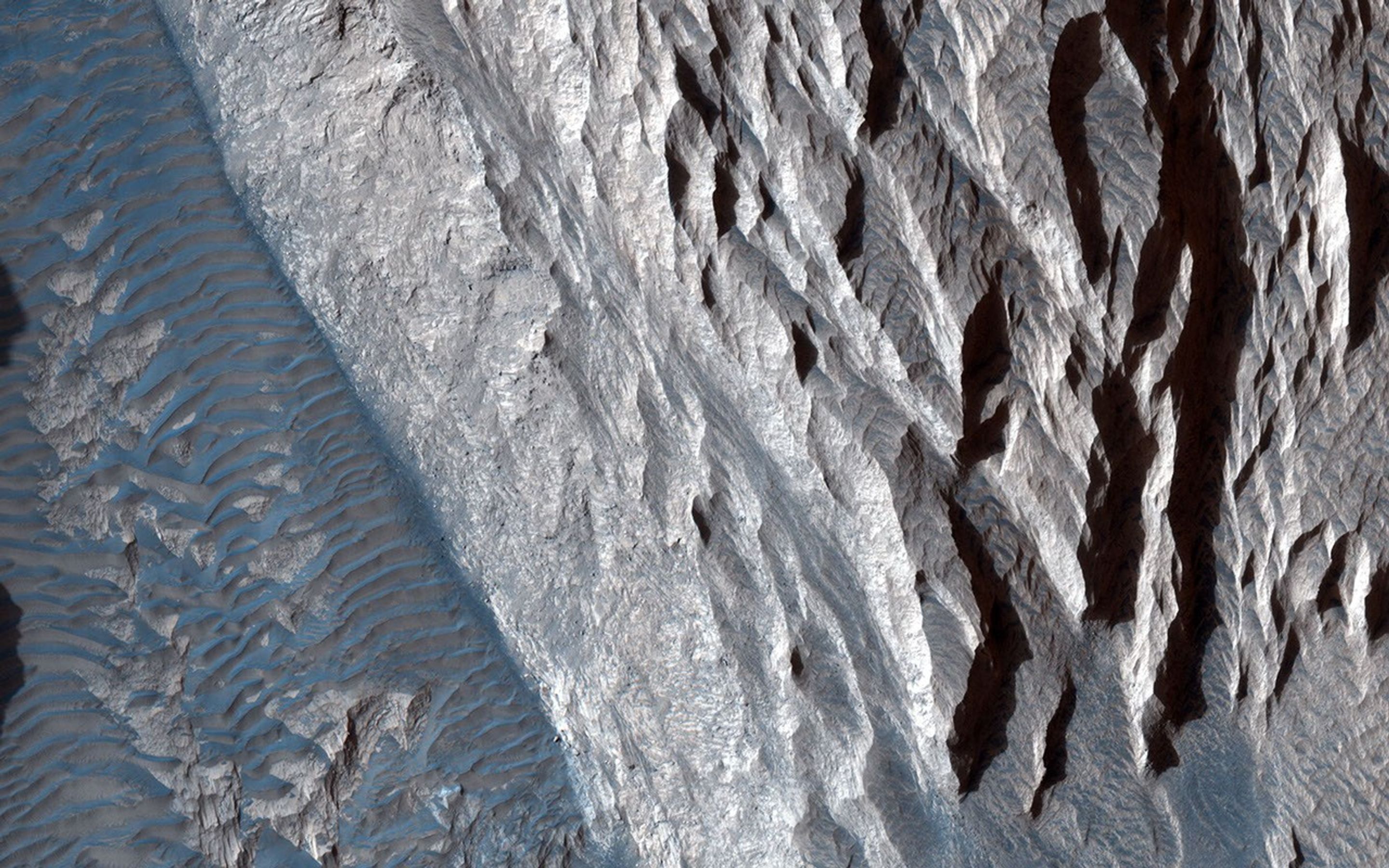 This observation from NASA's Mars Reconnaissance Orbiter shows one of the first close HiRISE views of the enigmatic Valles Marineris interior layered deposits.