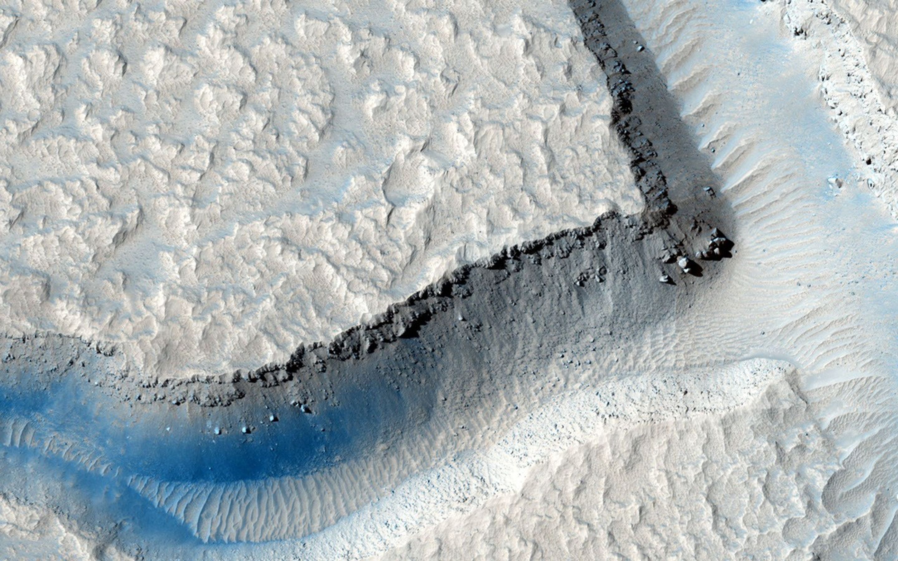 In this image from NASA's Mars Reconnaissance Orbiter, we see an intersection of several fractures on the floor of Echus Chasma. One 'sector' appears to have been filled by a more recent viscous lava flow.