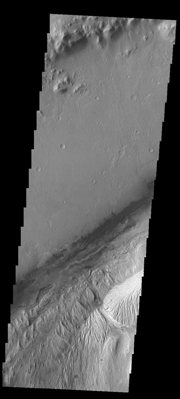 This image captured by NASA's 2001 Mars Odyssey spacecraft of Gale Crater shows the region of the crater that is 'home' to the Curiosity Rover.