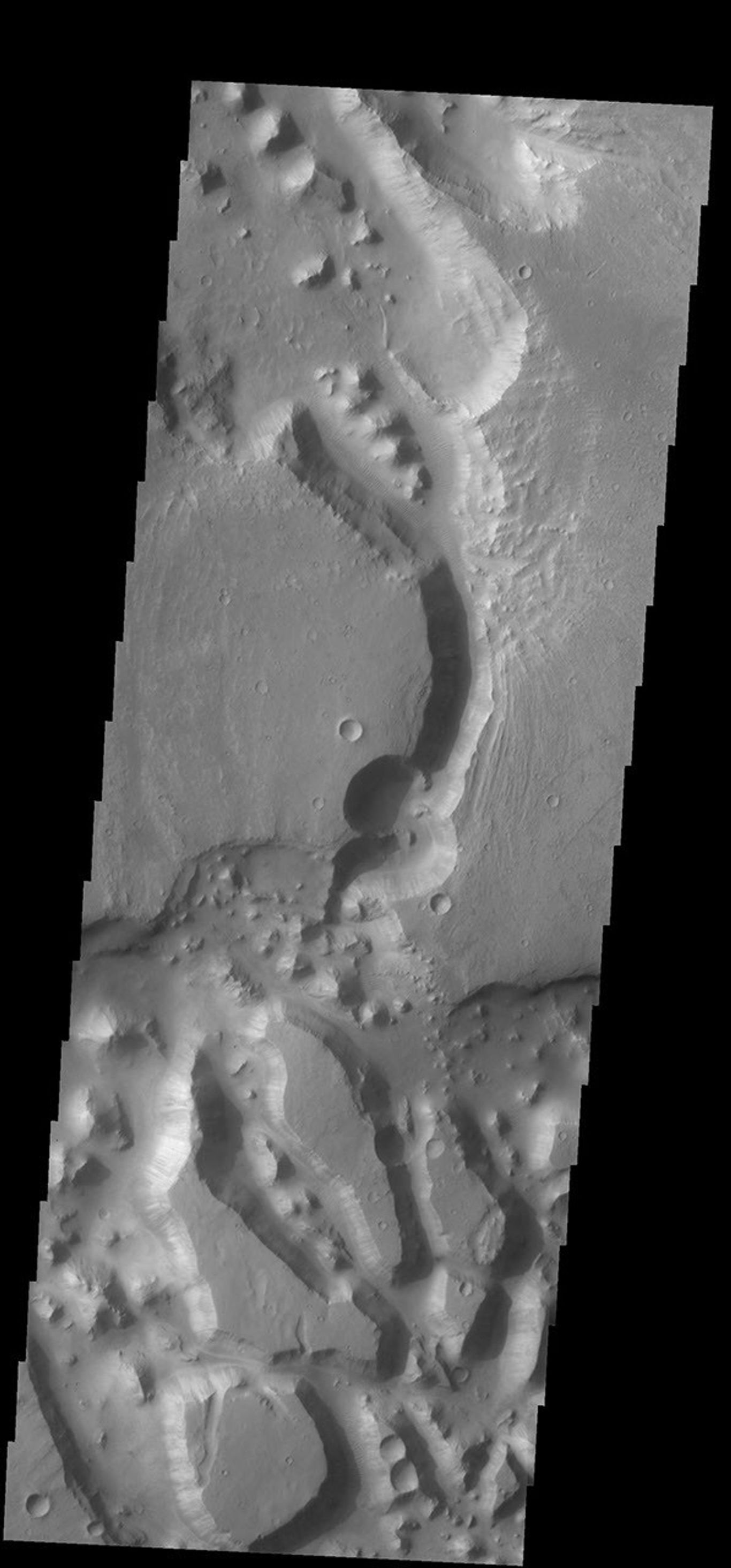 This complex region of channels and chaos is located south of Chia crater and east of the much larger Maja Valles. This image was captured by NASA's 2001 Mars Odyssey spacecraft.