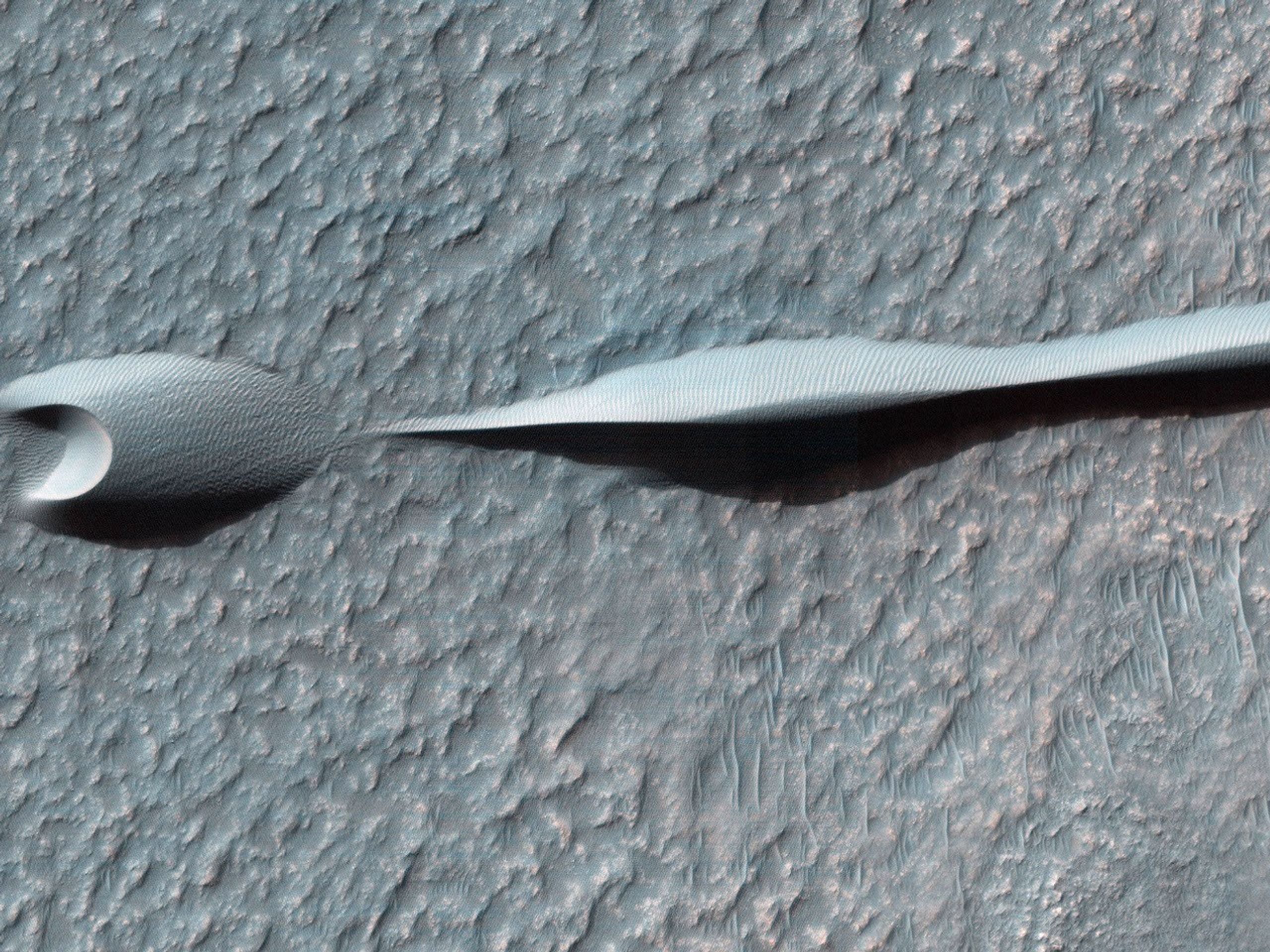 Sand dunes like those seen in this image from NASA's Mars Reconnaissance Orbiter have been observed to creep slowly across the surface of Mars through the action of the wind.