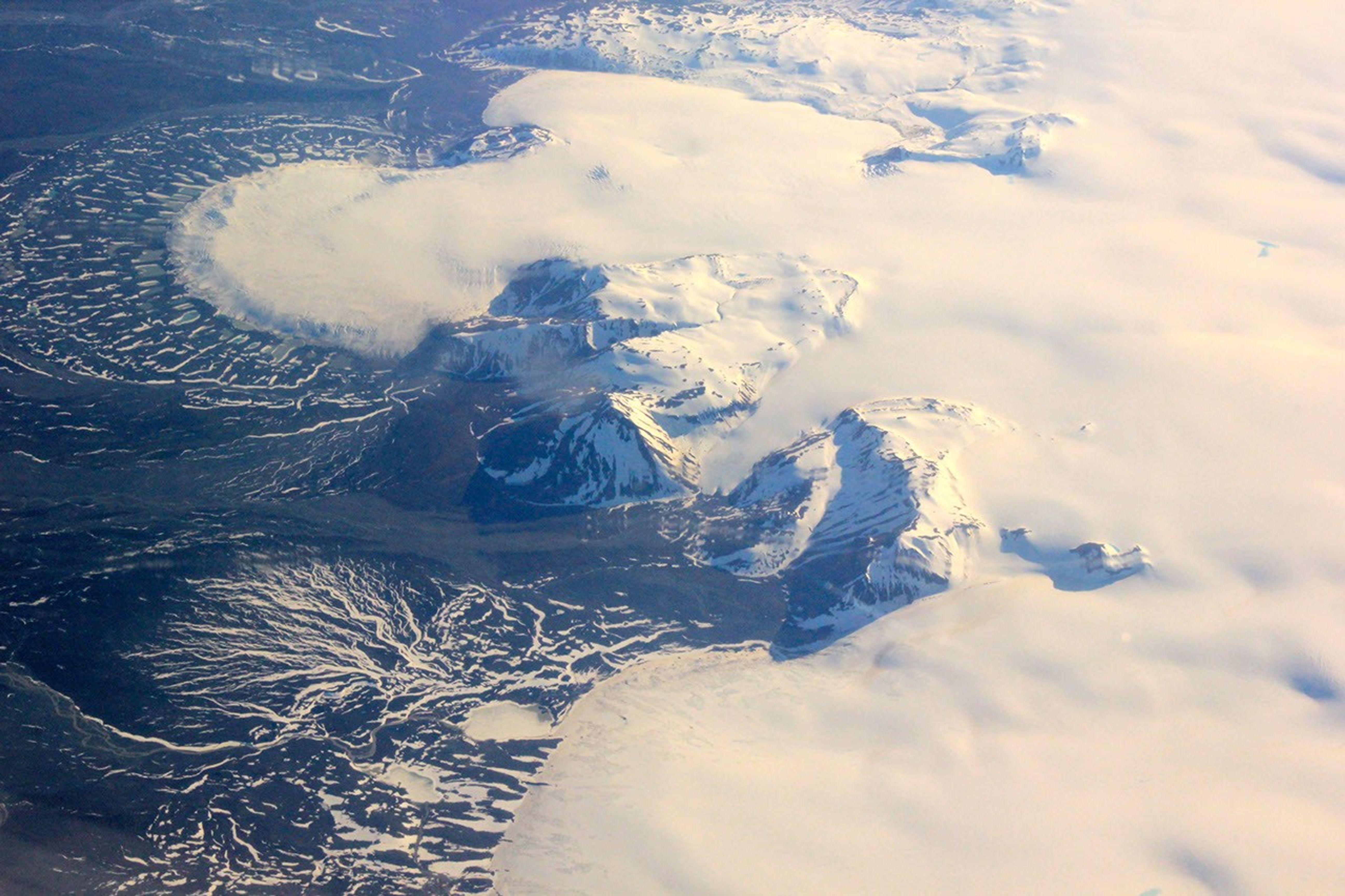 This image shows a small part of the Hofsjökull ice cap in Iceland, which encompasses several glaciers. The fan at upper left is part of a glacier called Mûlajökul.