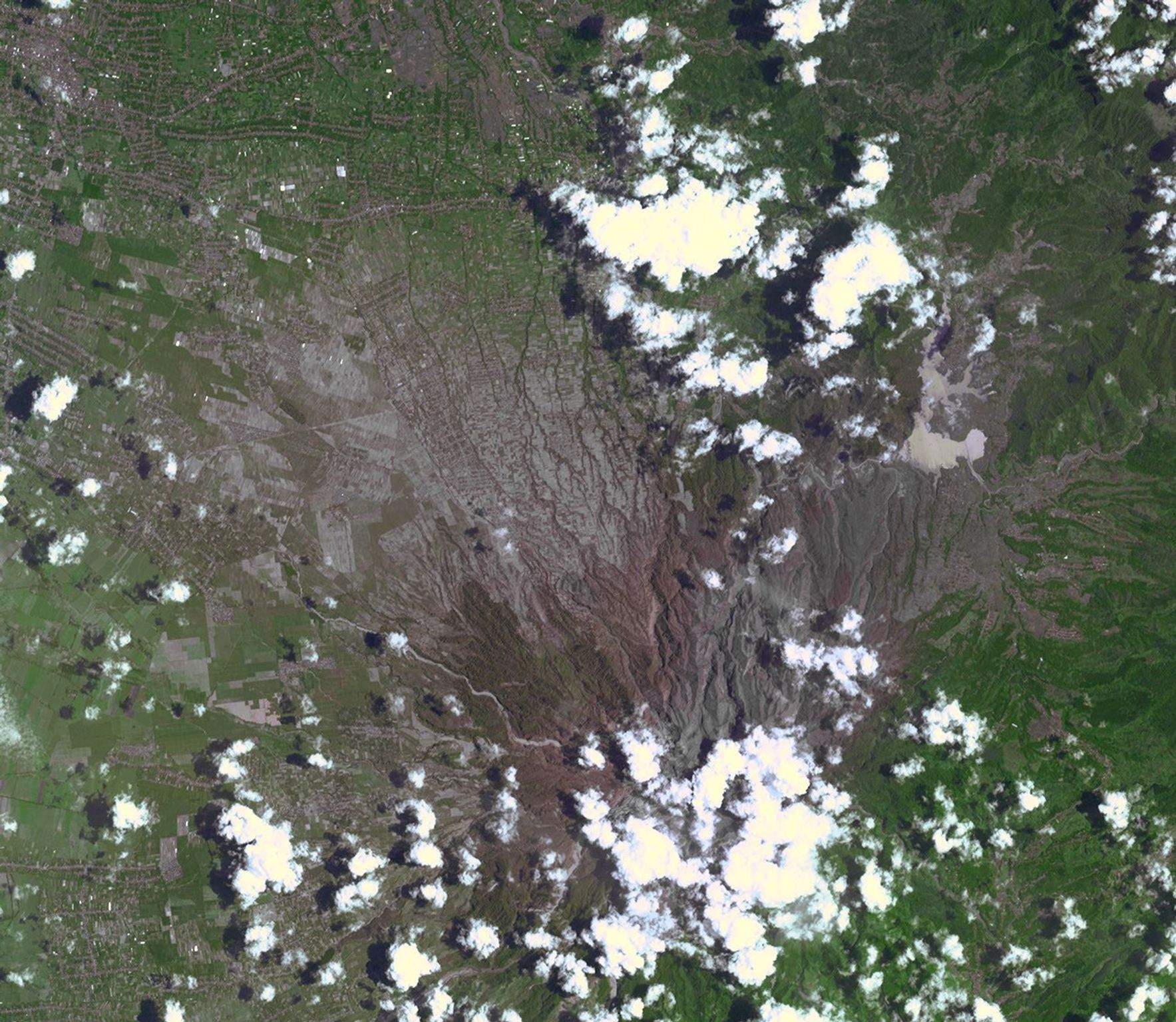 On Feb. 13, 2014, violent eruption of Kelud stratovolcano in Java, Indonesia sent volcanic ash covering an area of 70,000 square miles, prompting the evacuation of tens of thousands of people. This image is from NASA's Terra spacecraft.