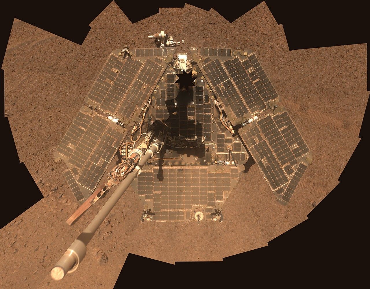 A self-portrait of NASA's Mars Exploration Rover Opportunity taken by the rover's panoramic camera (Pancam) in late March 2014 shows effects of recent winds removing much of the dust from the rover's solar arrays.