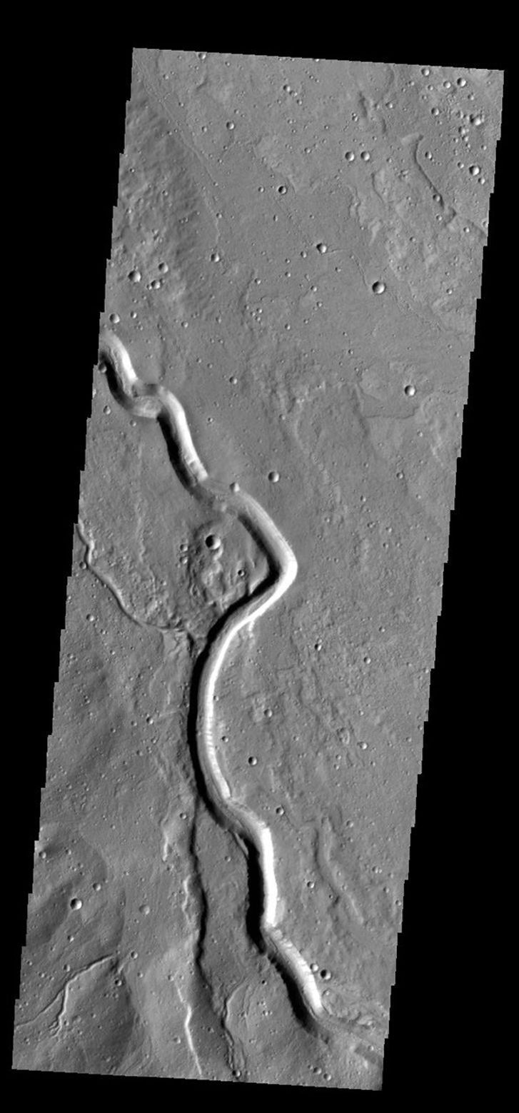 This image captured by NASA's 2001 Mars Odyssey spacecraft shows part of Buvinda Vallis, located just outside the northeastern flank of Hecates Tholus.