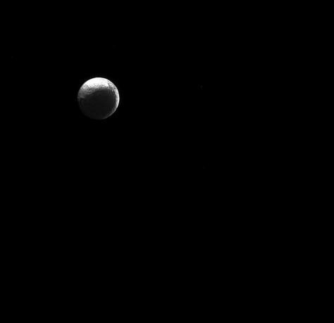 The moon Iapetus, like the 'force' in Star Wars, has both a light side and a dark side. Scientists think that Iapetus' dark/light asymmetry was actually created by material migrating away from the dark side.