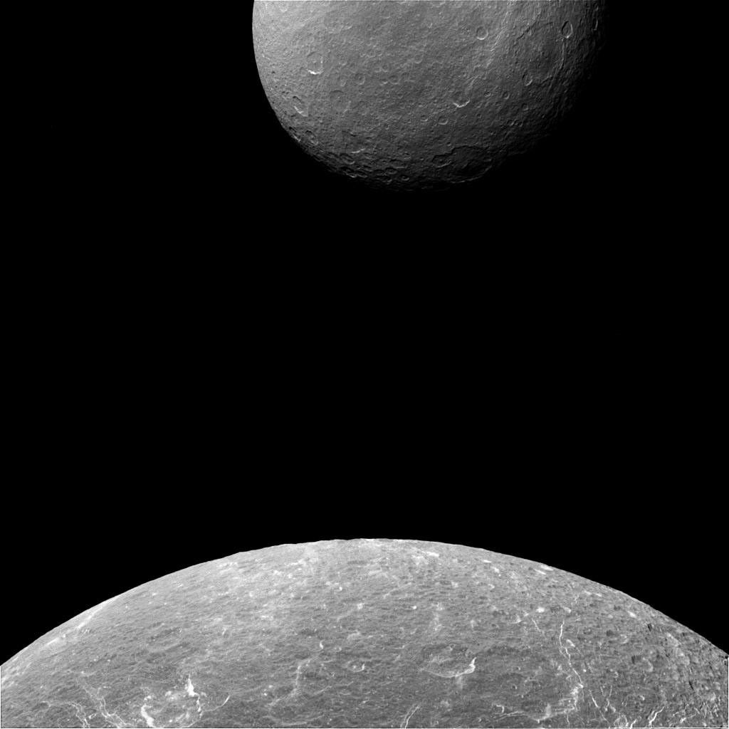 NASA's Cassini spacecraft captured this image when Dione was closer to its camera, making the moon appear much bigger than her larger sister moon, Rhea.