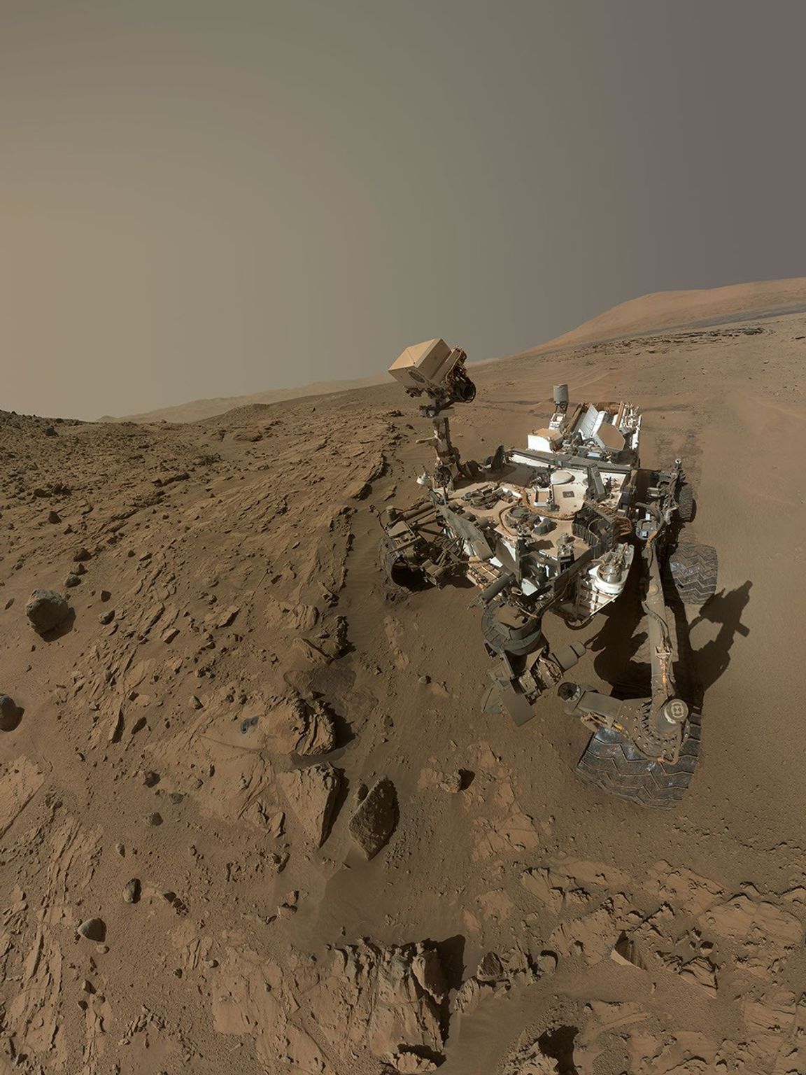 NASA's Curiosity Mars rover used the MAHLI camera at the end of its arm in April and May 2014 to take dozens of component images combined into this self-portrait where the rover drilled into a sandstone target called 'Windjana.'