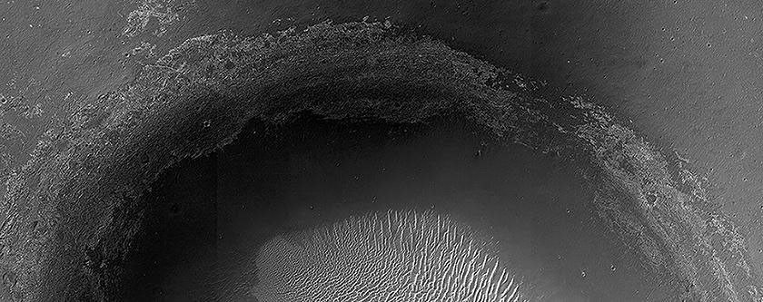 This crater, seen by NASA's Mars Reconnaissance Orbiter, is located in Meridiani Planum, about 20-kilometers northwest of where NASA's Opportunity rover landed in 2004 and about 42-kilometers northwest of Endeavour Crater's rim.